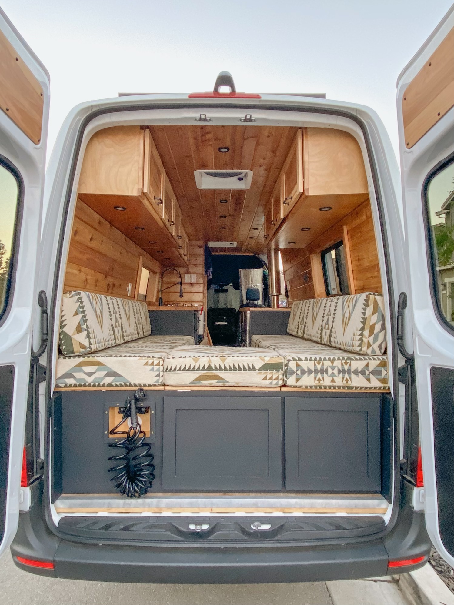 Explore van life in this custom RV rental! Warm wood interior, cozy seating, and outdoor shower for your next adventure.. Other Sprinter 2019