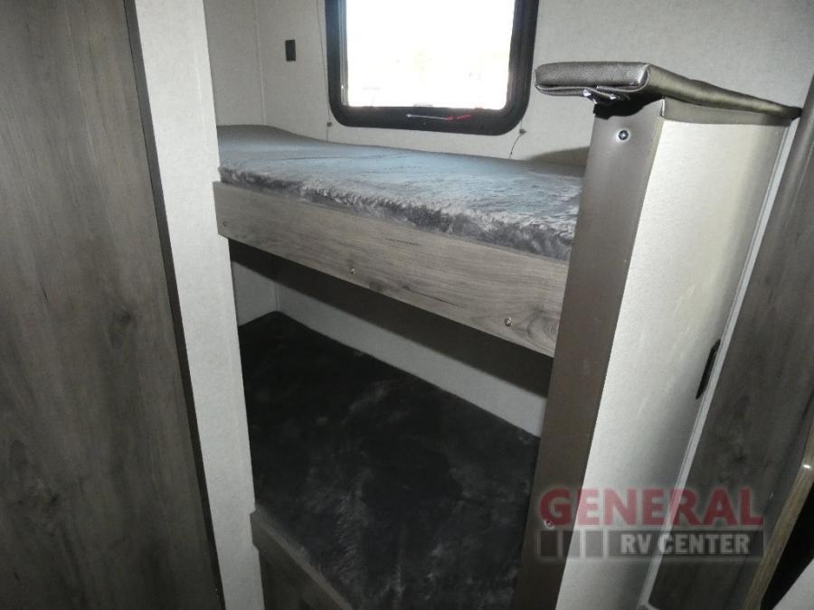 Visually impaired users: Image shows a compact RV rental interior with wooden bunk beds, providing efficient sleeping space for travelers.. Coachmen Clipper 2022