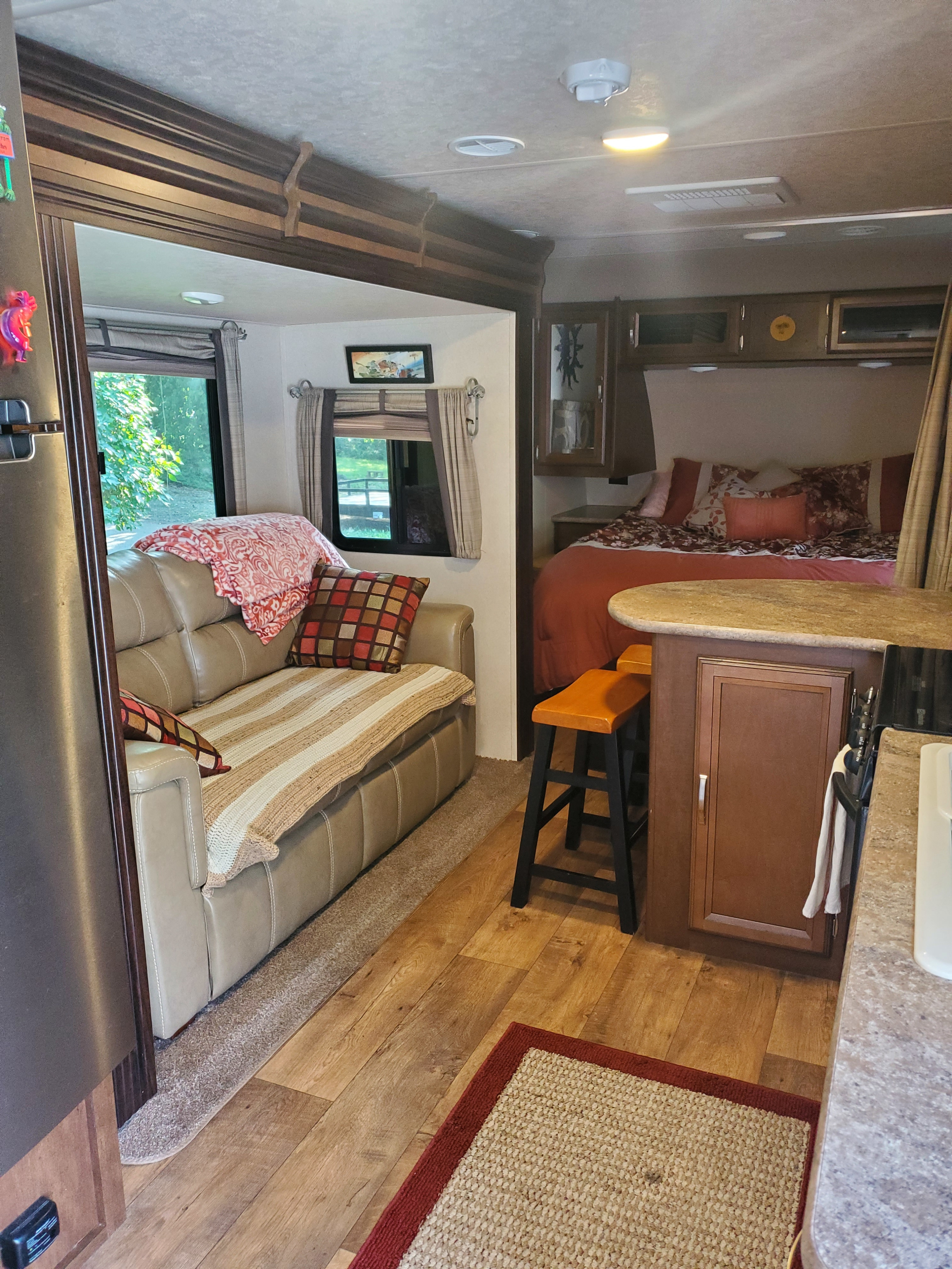 Queen bed (upper right), bar stool seating (lower right) and couch.  Slide out will go another 2 feet out so there is plenty of walking space.. Forest River Other 2017