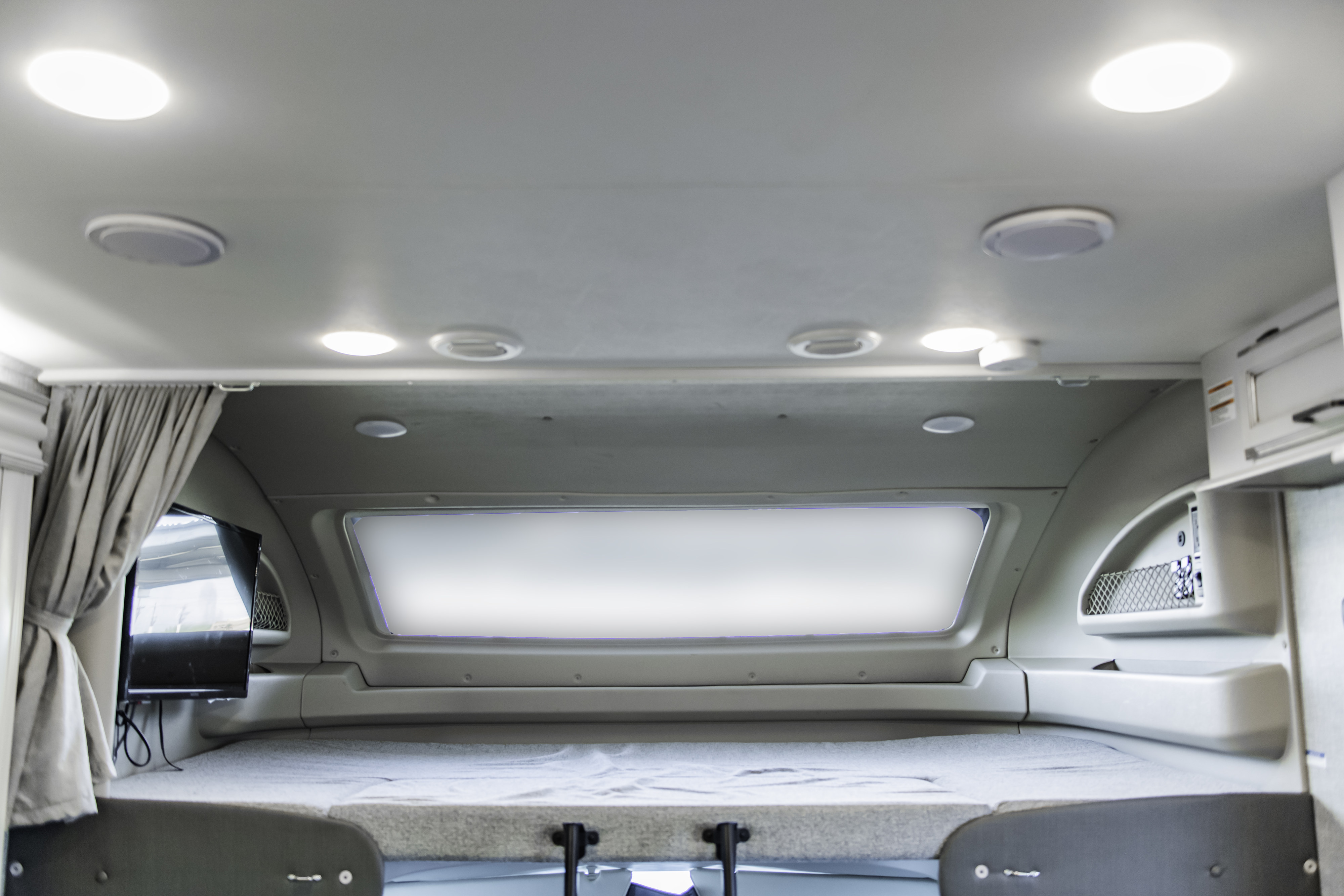 One of our favorite features of the RV is the big space above the cab! There is a lot of storage and a TV.  Weight limit is 750lbs.. Other Other 2022