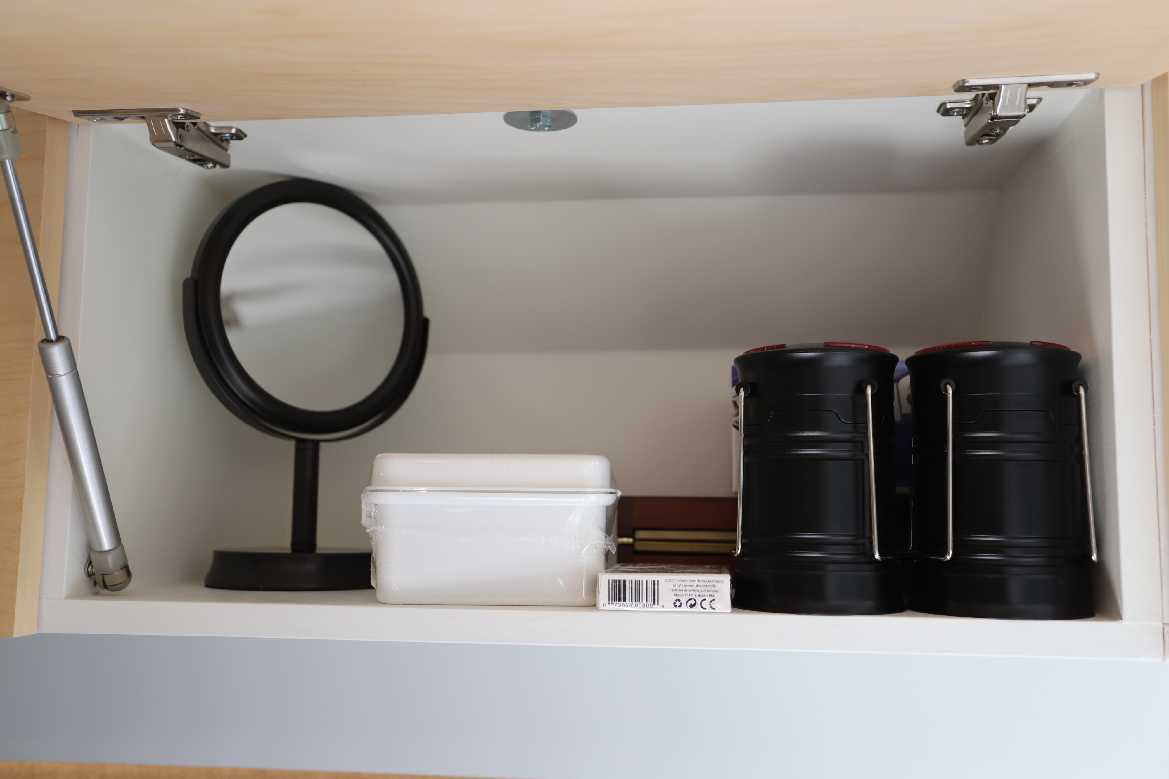 RV rental cabinet essentials: A mirror, playing cards, and camping lanterns for your comfortable journey.. Dodge Promaster 2500 2019