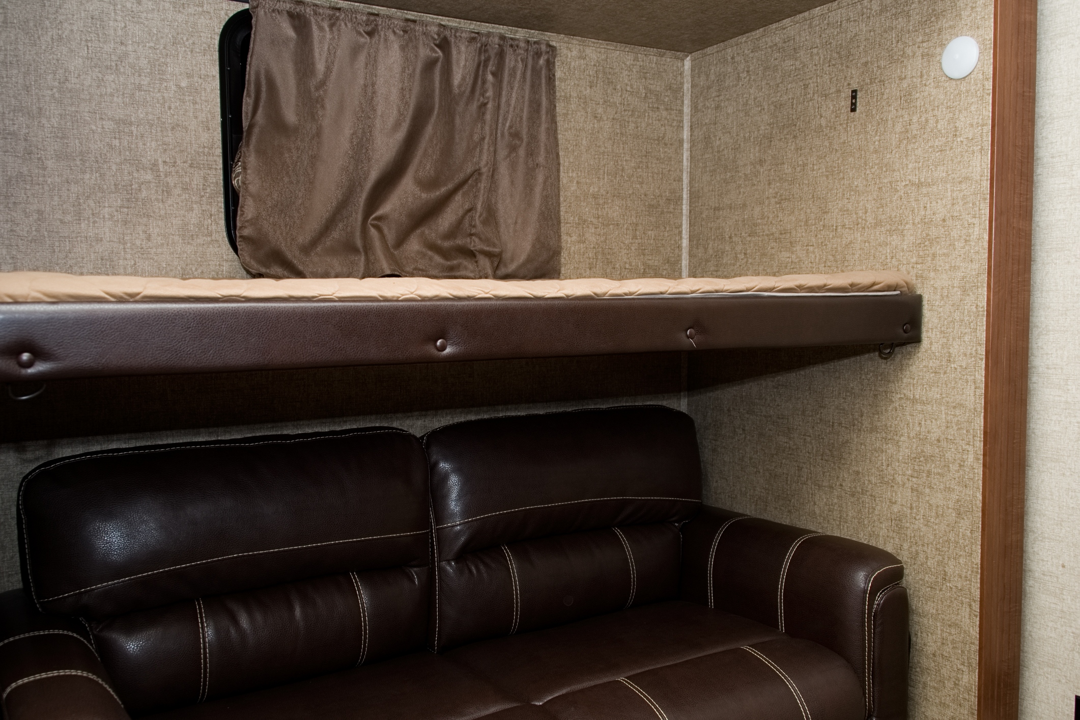 Bunkbed folds up out of the way to enjoy some TV in some private space.
Sofa pulls out to a full bed. Forest River Sierra 2016