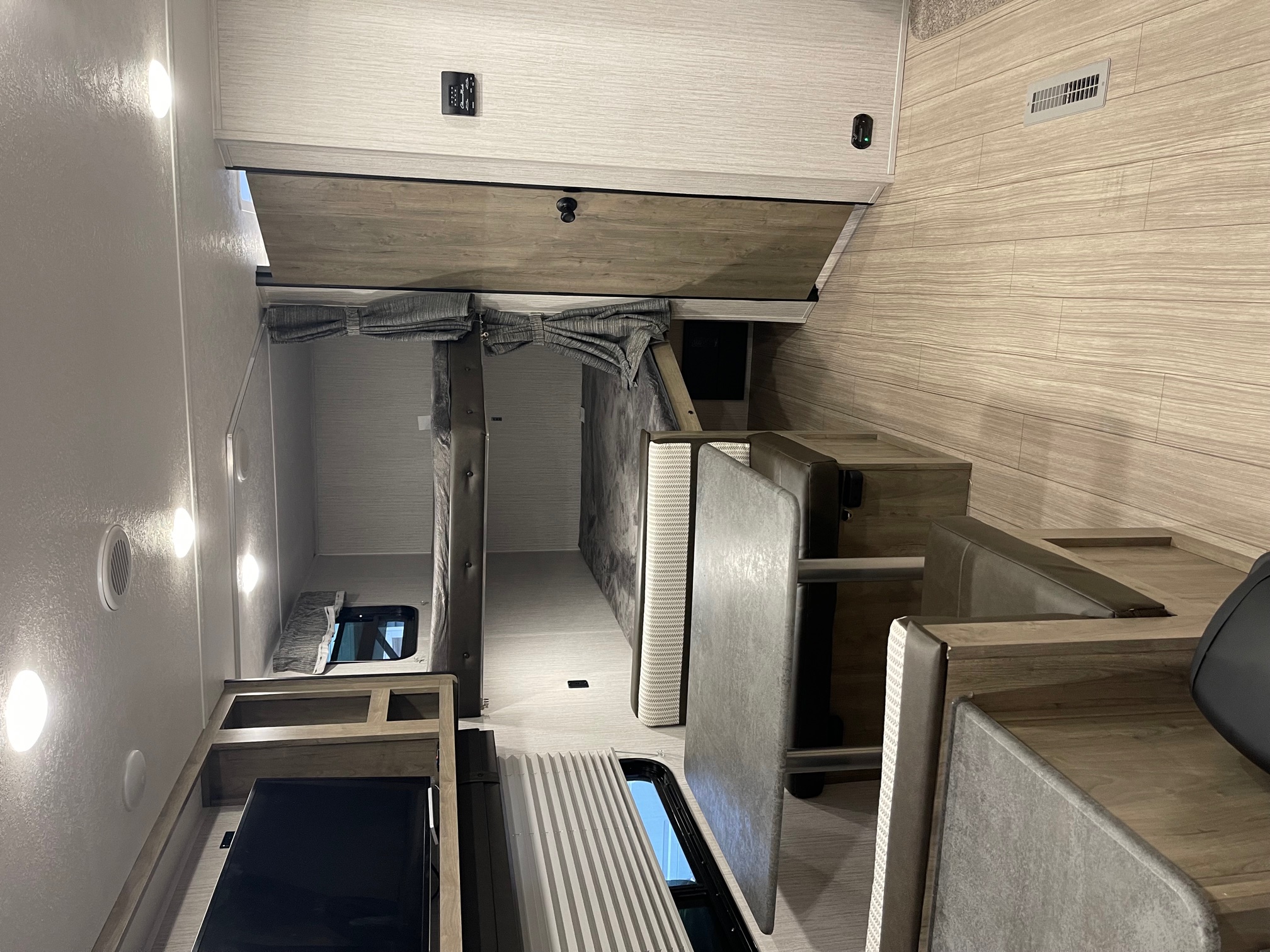 Explore this RV rental's modern interior featuring cozy bunk beds, a versatile dinette, and ample storage for comfortable travel.. Palomino Puma 2022