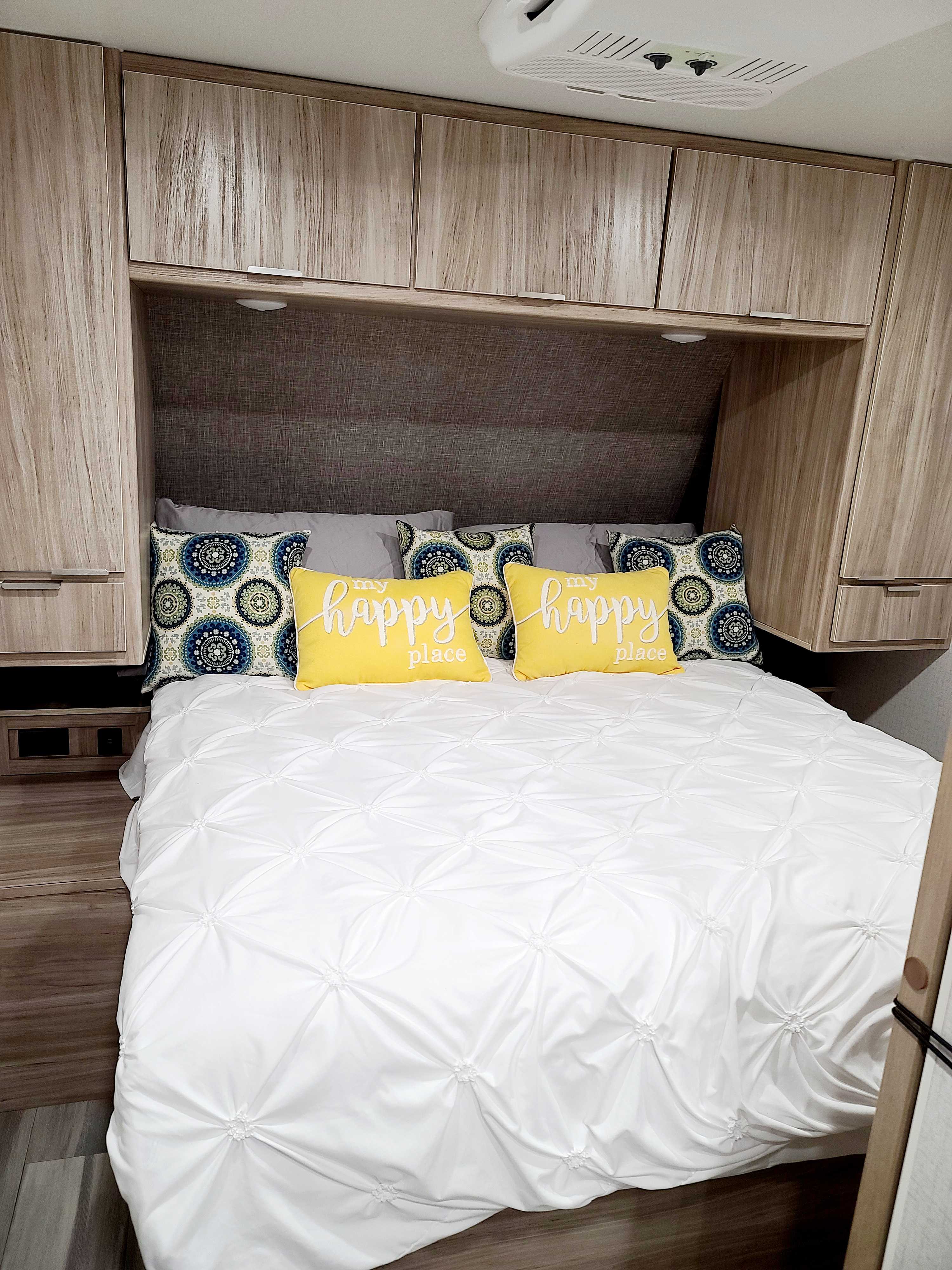 Master bedroom with Queen Serta Sleeper and lots of storage. Winnebago Minnie 2022