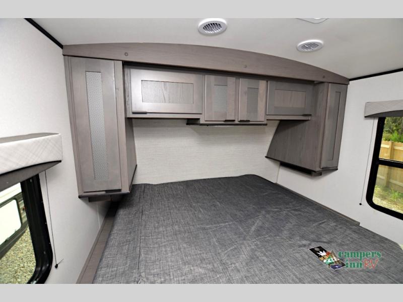 RV rental bedroom interior: spacious bed, overhead storage, & side cabinets. Perfect for your next adventure.. Cruiser Rv Corp Cruiser 2022