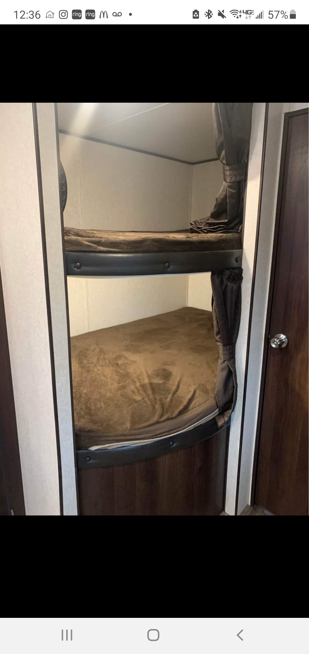 RV rental: Get cozy in these stacked bunk beds with brown bedding and privacy curtains inside our travel trailer.. Jayco Jay Flight 2019