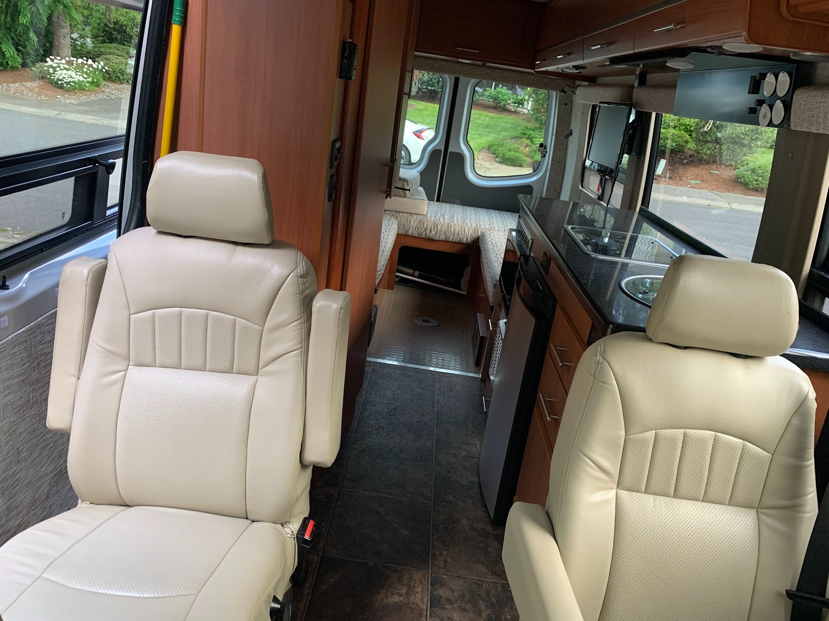 Showing second passenger row and the bed in day mode. You can also see the kitchenette. Other Other 2012