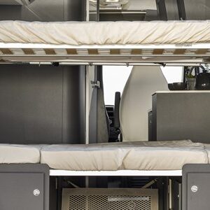 This RV rental interior features stacked bunk beds, showcasing a compact camper van sleeping area ideal for family travel.. McLouis Menfys Van 3 Maxi 2024
