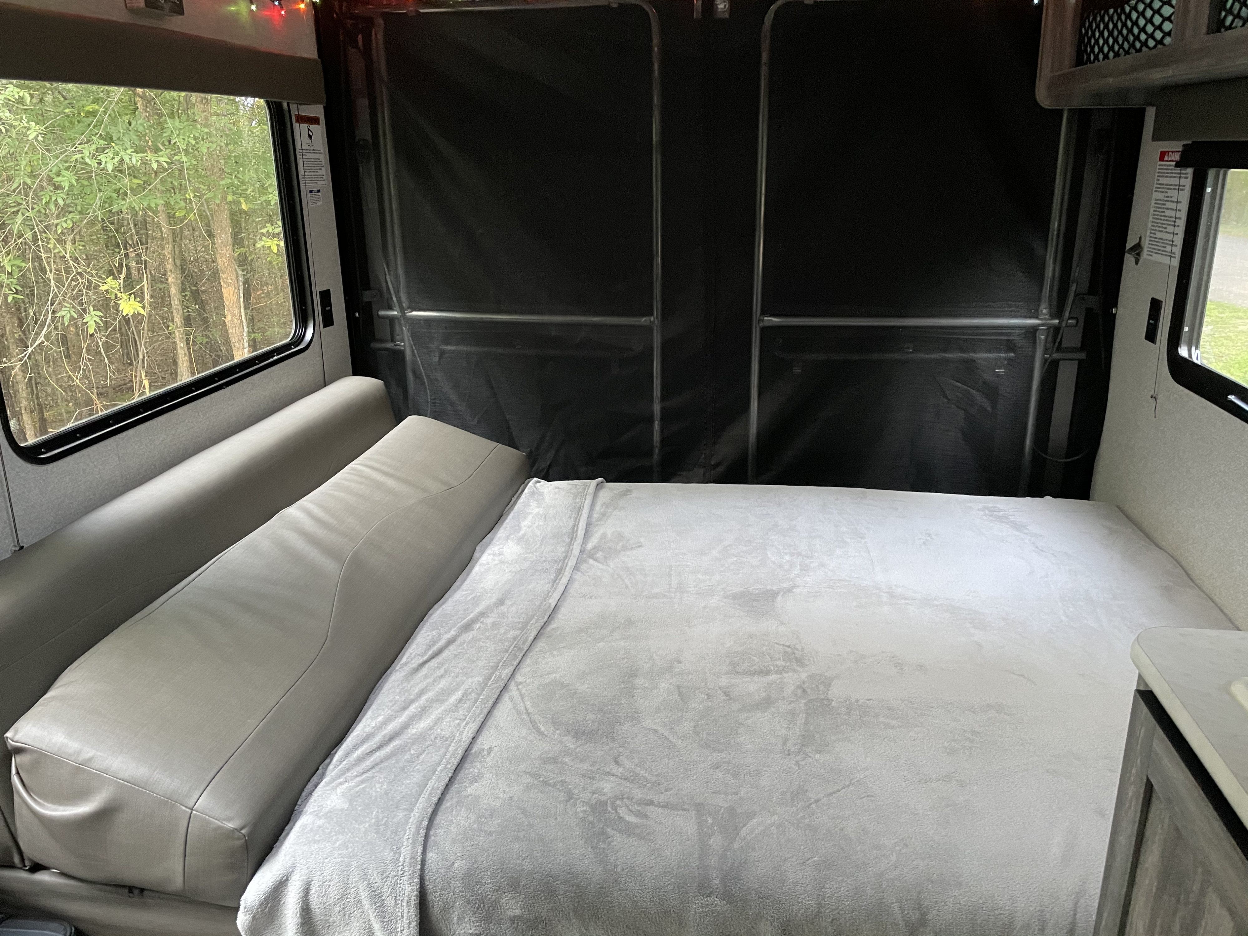 The dining table collapses to form a king size bed. . Forest River Wildwood 2019