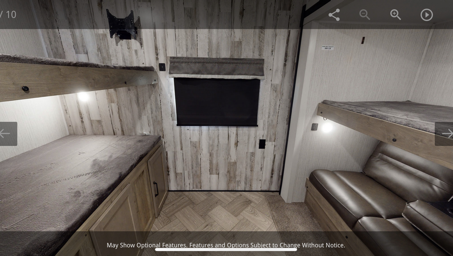 RV rental bunkhouse area: two sets of bunks, a convertible sofa, TV, and storage for a cozy stay.. Forest River Puma 2021