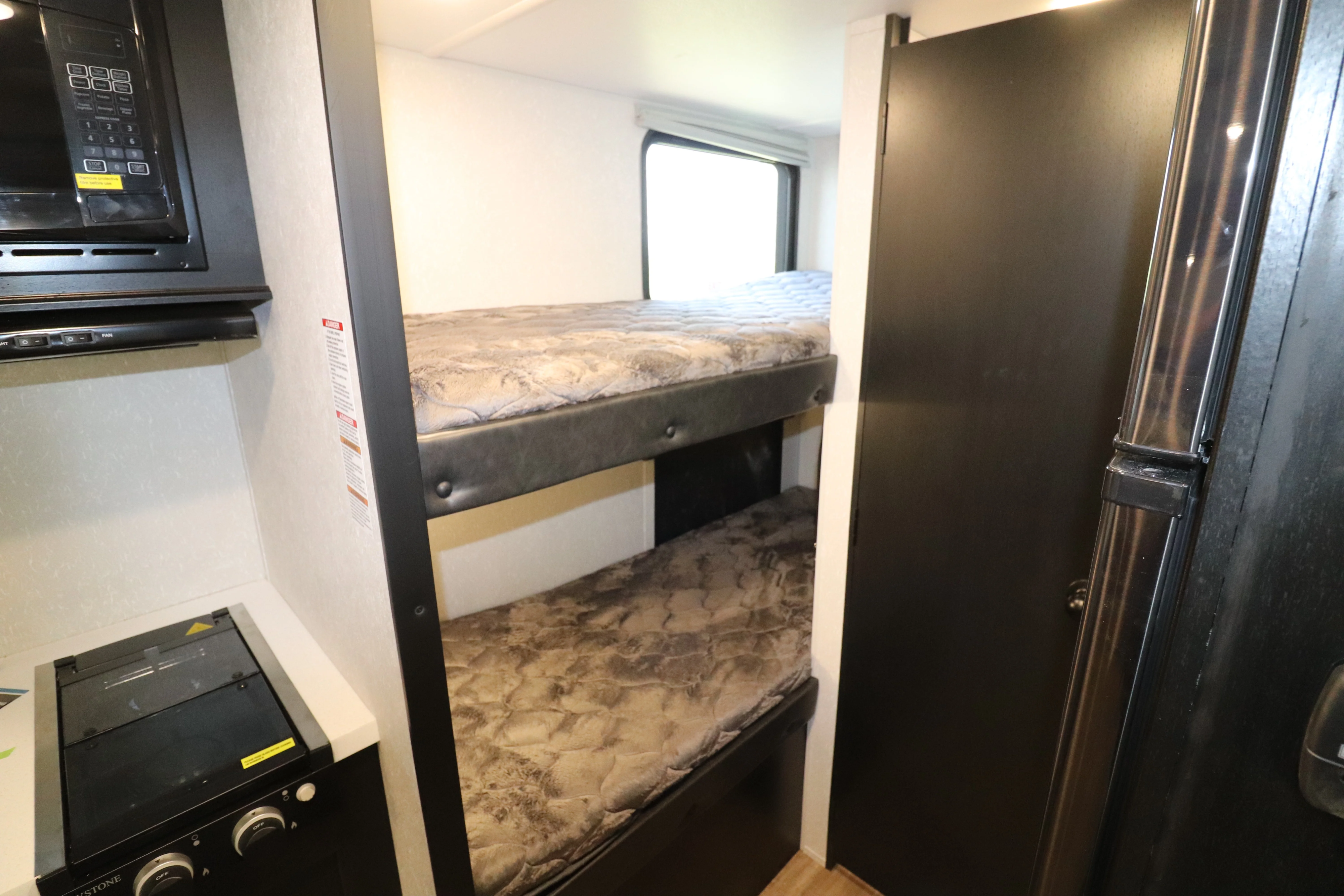 Two bunks with a window and usb charging outlets. Perfect for kids!. Forest River Cherokee Wolf Pup 2022