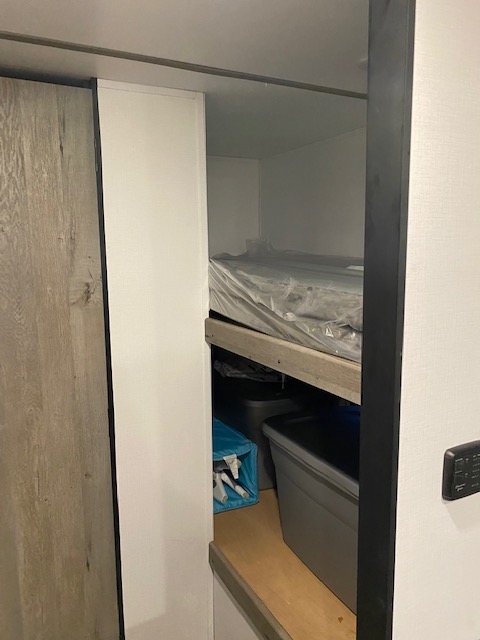 RV rental interior: Bunk bed with covered mattress & lower storage area with bins.. Other Springdale 2021
