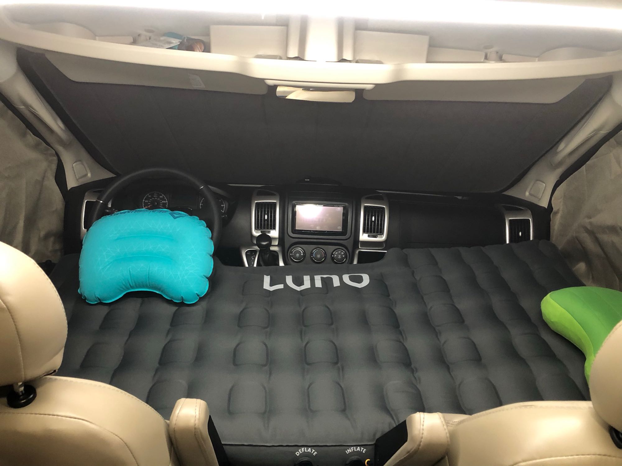 RV rental interior: Luno air mattress fills the front, creating a comfortable camper van sleeping area with pillows.. Thor Scope 2022