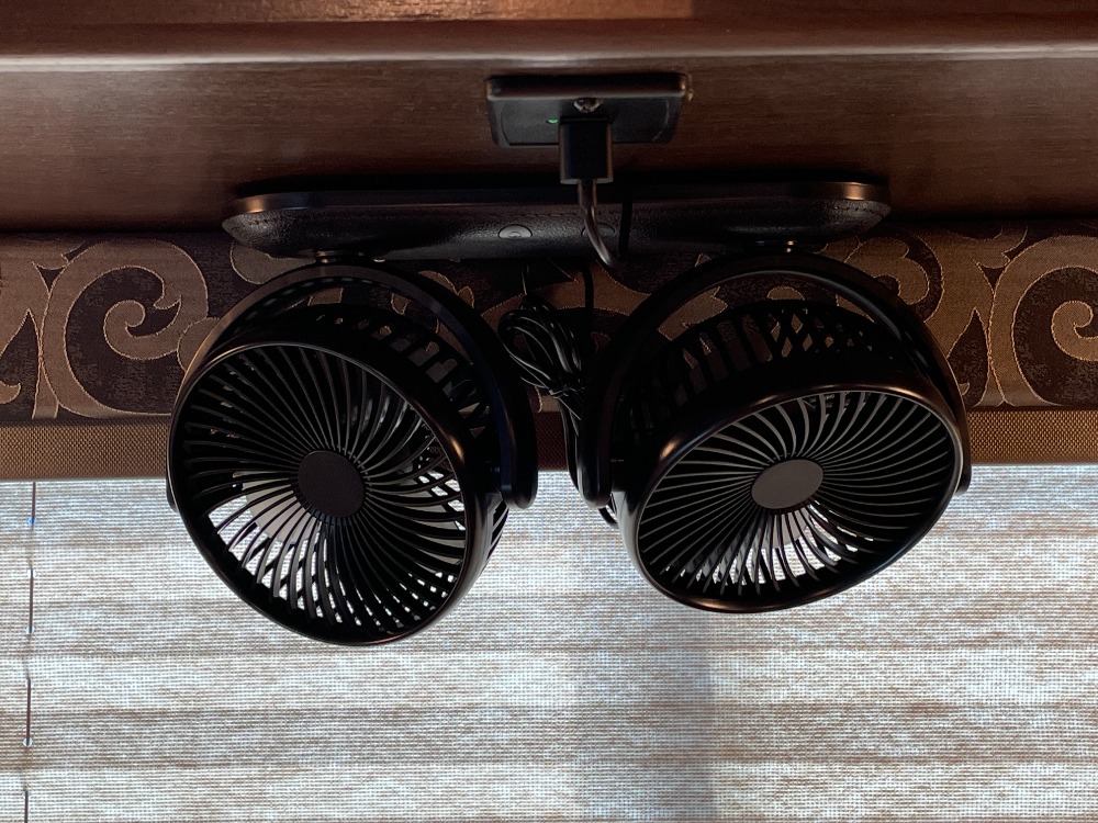 Compact black fans mounted overhead in an RV rental for enhanced air circulation & comfort.. Thor Freedom Elite 2020