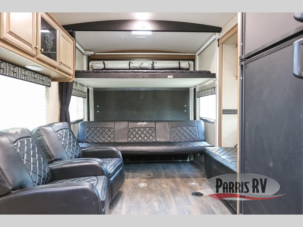 Spacious RV rental interior featuring convertible living space, bunk beds, and comfortable recliners.. Stryker ST-2912 2016