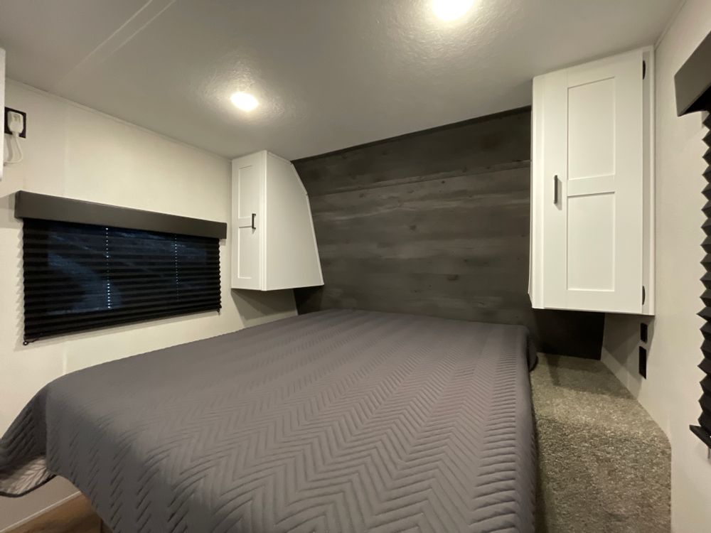 Nice Queen bed with enough room for two people they can get up without waking/disturbing the other person.. Keystone RV Hideout 2021