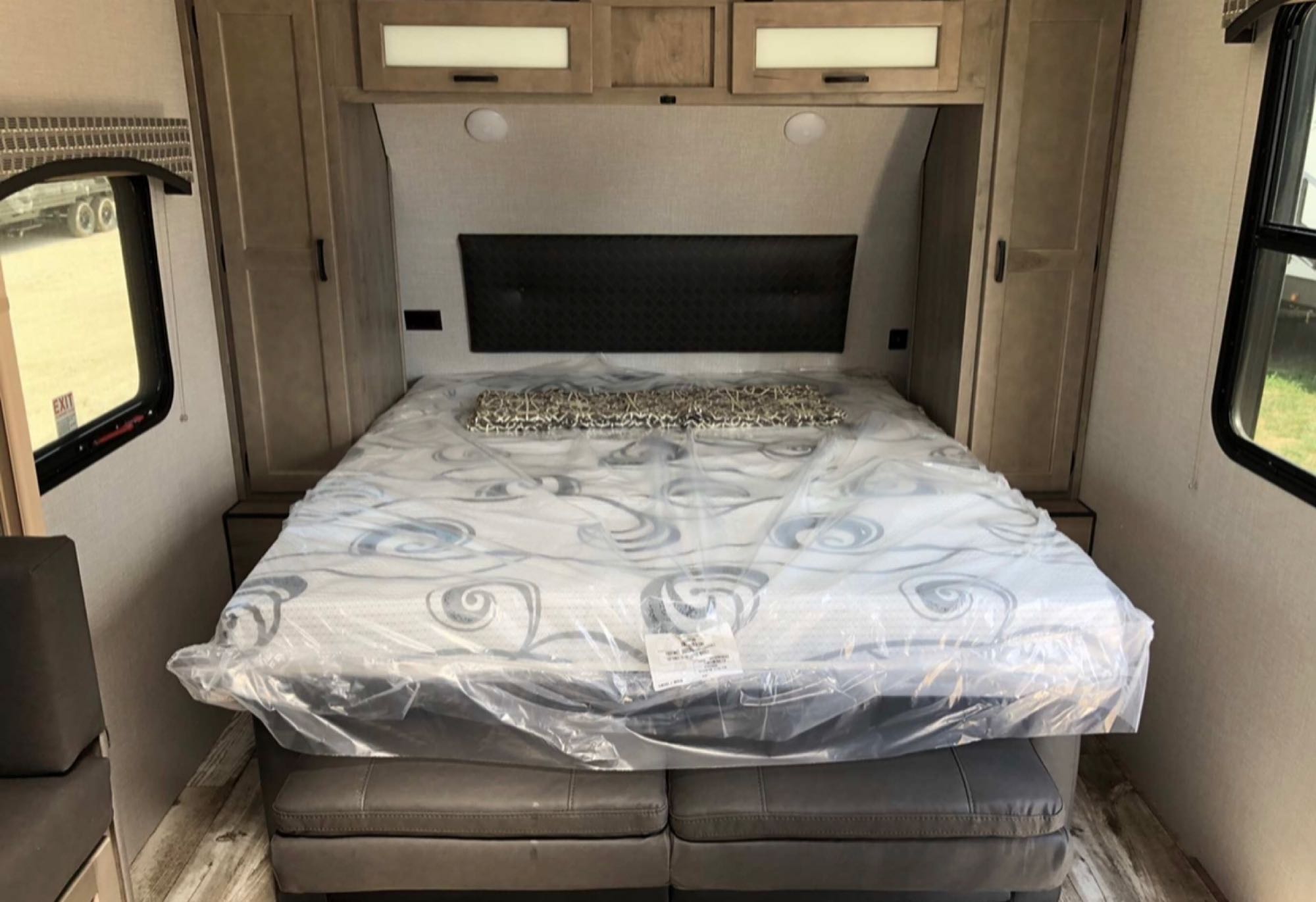 Explore comfort! This RV rental bedroom offers a new bed, storage, and windows, ideal for travel accommodation.. Sonic Sonic Trailer 2025