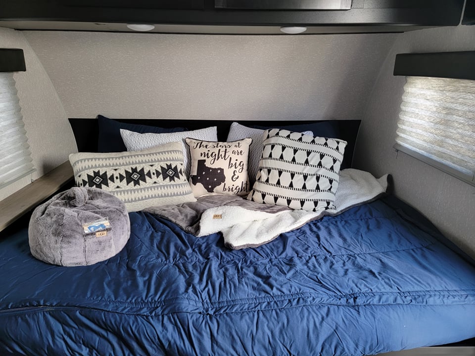 Queen Bed with Luxury Bamboo Pillows. Towels included. TV mounted to the right above window. . Forest River Cherokee Wolf Pup 2022