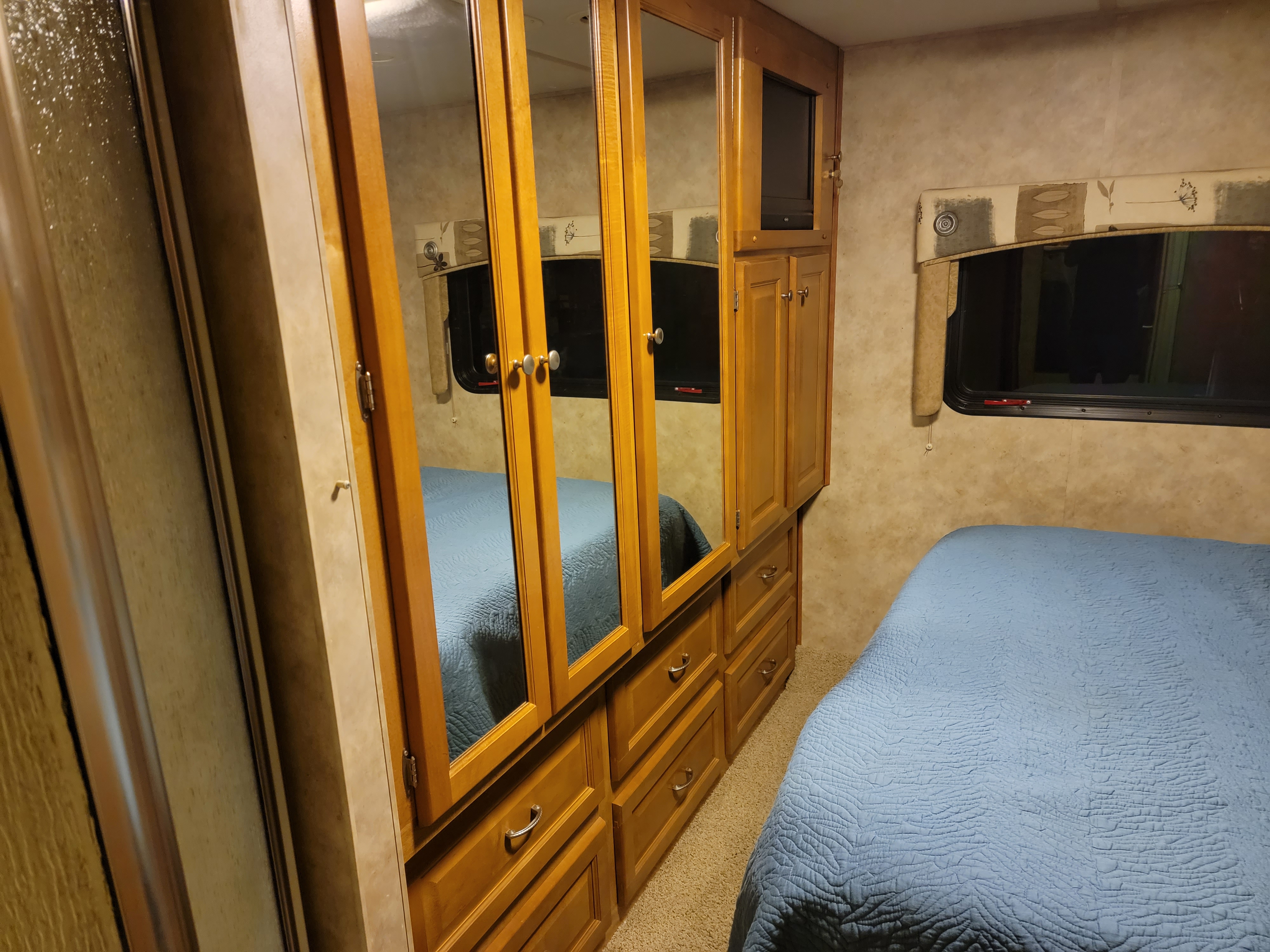 Large amount of cedar closet space behind custom wood and mirror doors.. Gulf Stream B Touring Cruiser 2008