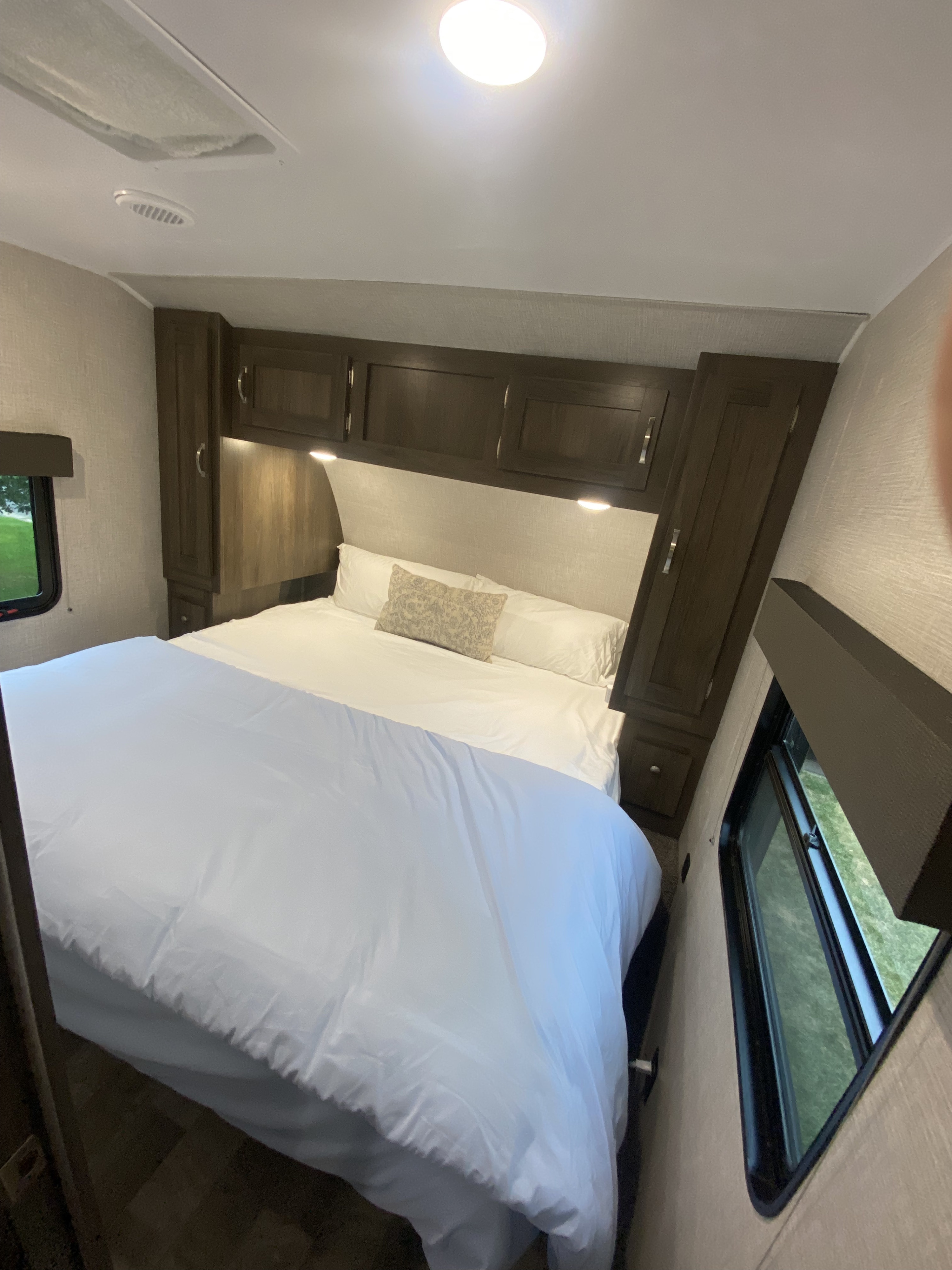 King sized bed with foam mattress pad. . East to West Della Terra 2021