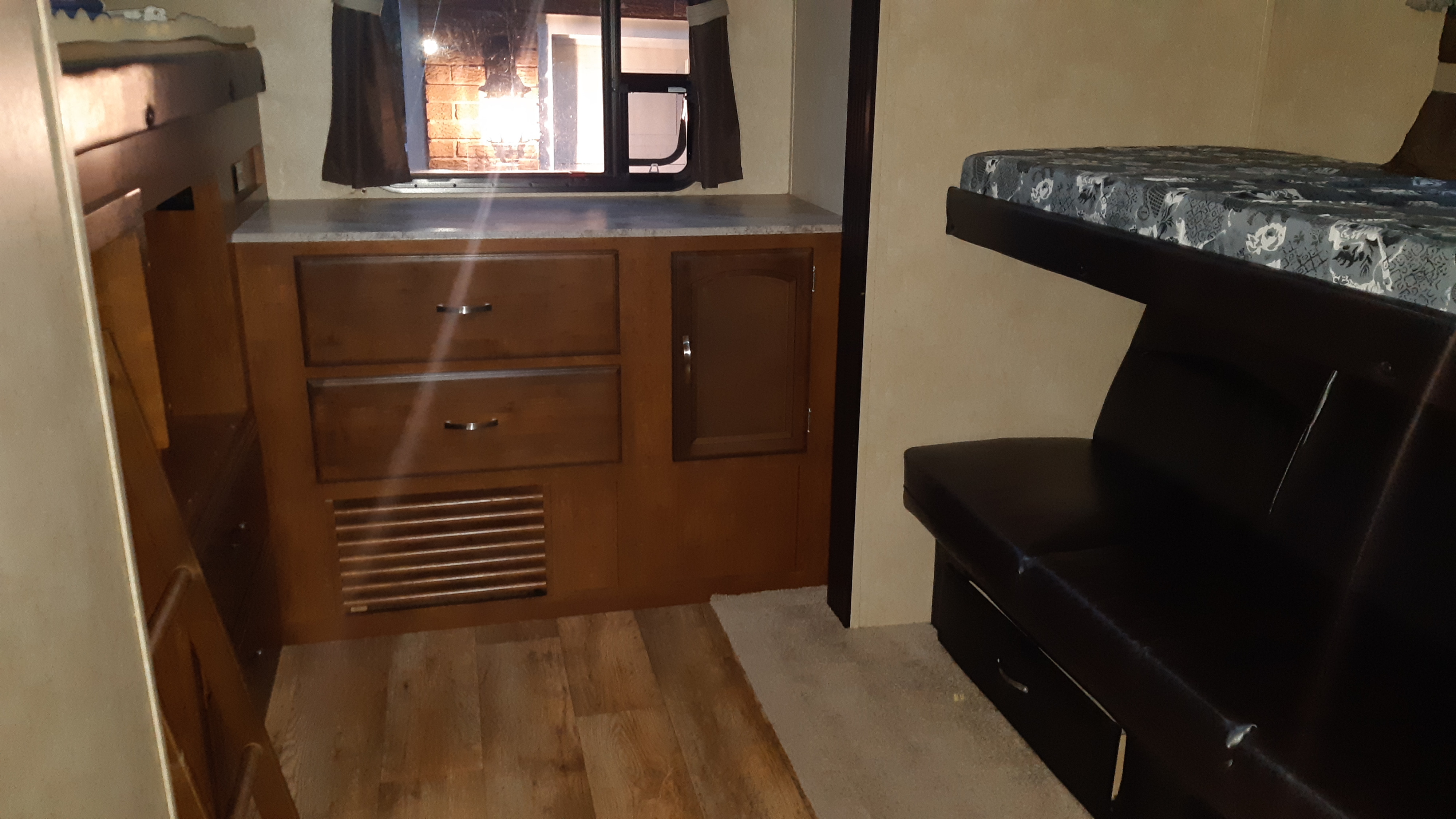 RV rental interior: bunk beds, storage, and a window. Comfortable space for travel.. Forest River Salem Hemisphere Lite 2016