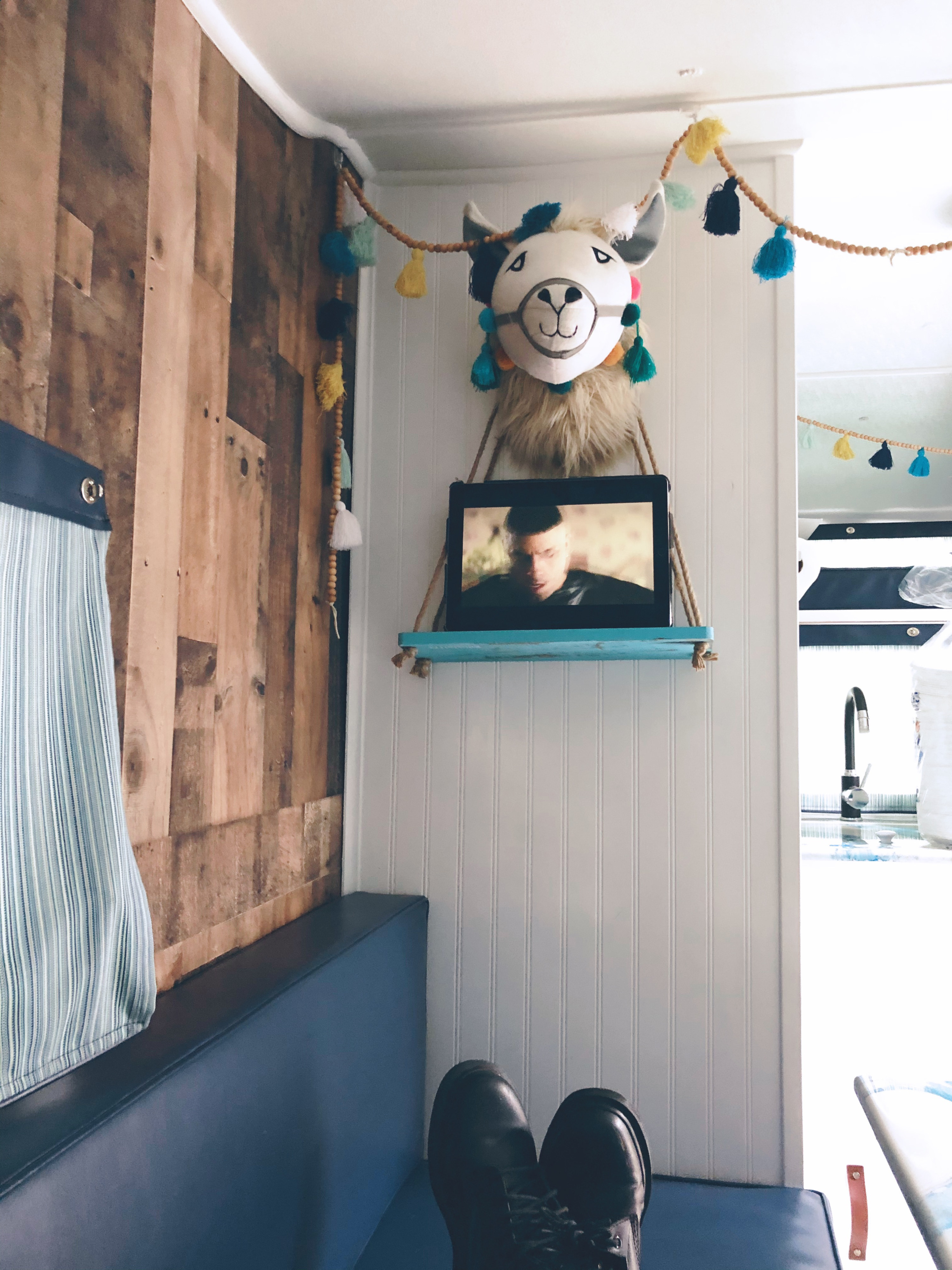 Enjoy this shelf over the sleeping area to put your phone or tablet to watch during the day and enjoy a projector movie at night. . Custom Camper Trailer 1963