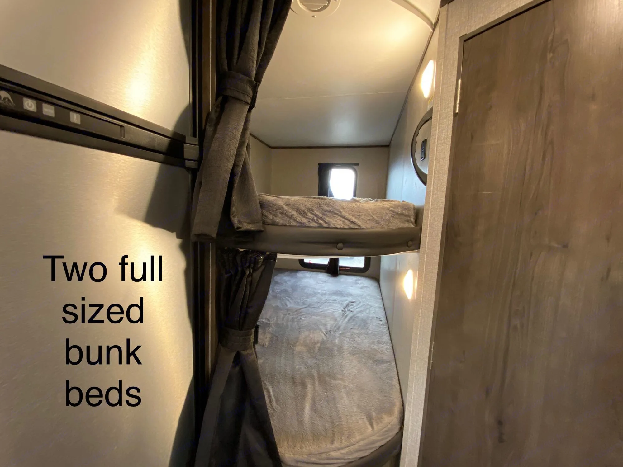 Spacious RV rental with two cozy full-sized bunk beds. Perfect for families, featuring ambient lighting and a private feel.. Jayco Jay Flight SLX Baja Edition 2021