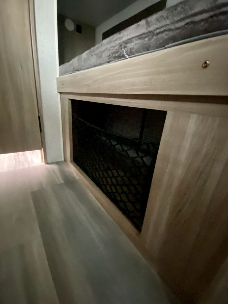 RV rental interior: lower view of a bunk bed with a built-in mesh storage net below.. Winnebago Micro Minnie 1800BH 2022