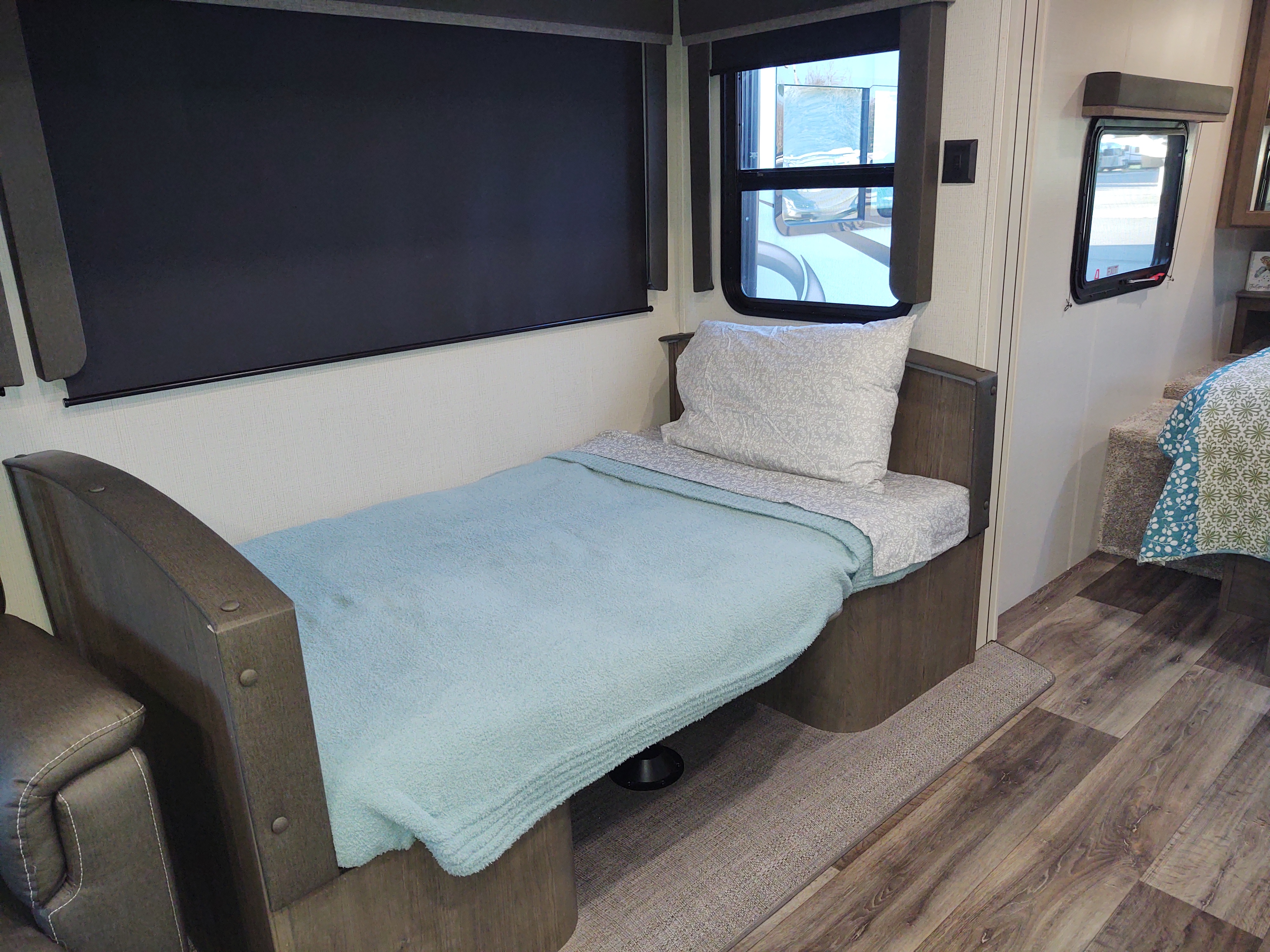 Dinette booth reconfigured for sleeping. Keystone RV Cougar 2021