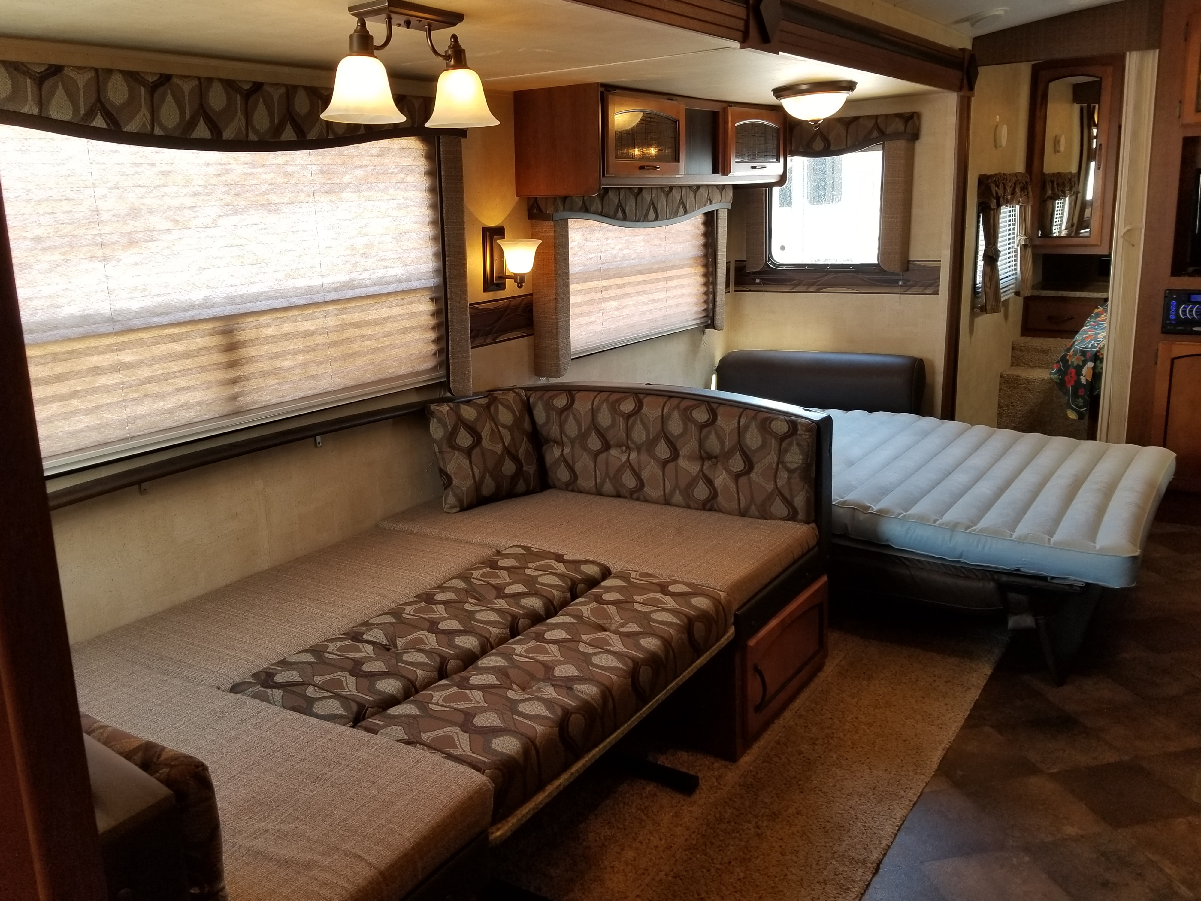 Dining room/ Living room converted to sleeping quarters. Fold out bed has an air mattress built in! . Keystone RV Springdale 2013