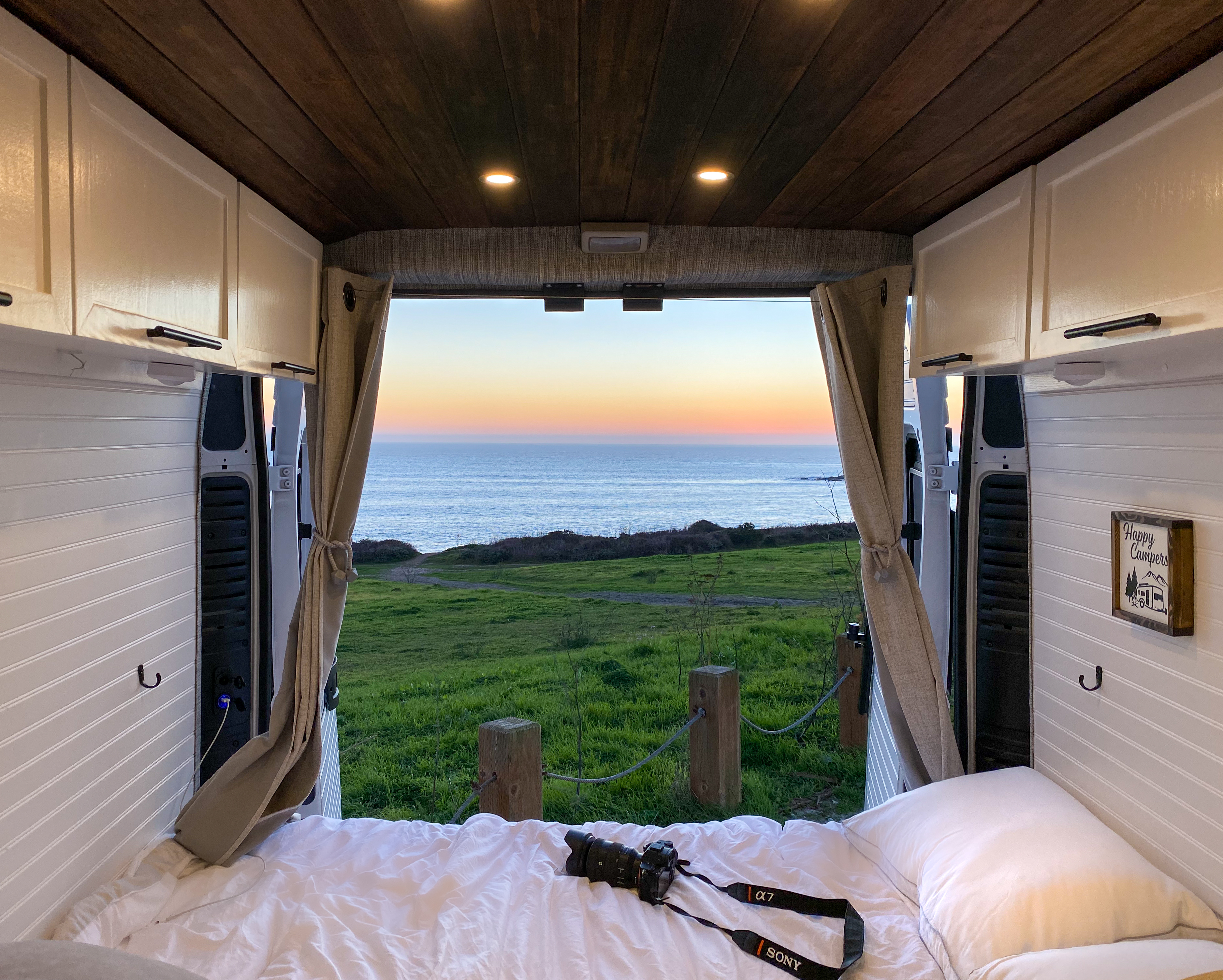 Wake up to amazing coastal views from this cozy rv rental. Perfect for van life, this camper features a comfy bed & ocean sunsets.. Dodge Ram Promaster 2500 2018