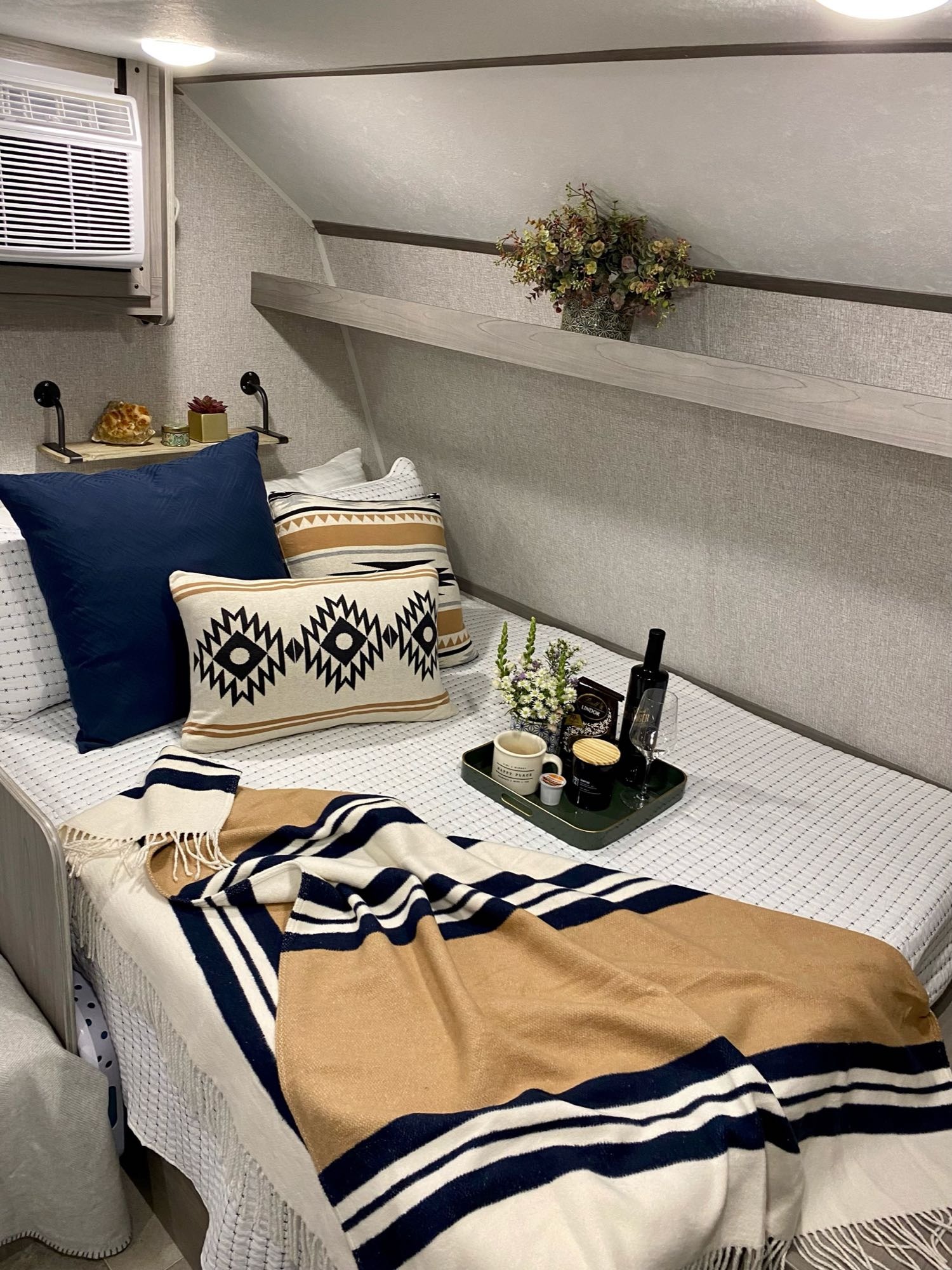 Short queen size bed with added 8” memory foam mattress. AC unit above bed, and a tv on the other wall across from it. Fresh clean linen included.. Coleman Lantern 17B 2022