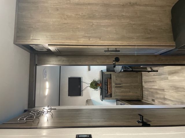 RV rental: Modern wood interior with TV & storage. Ideal for comfortable travel.. Heartland Pioneer 2021