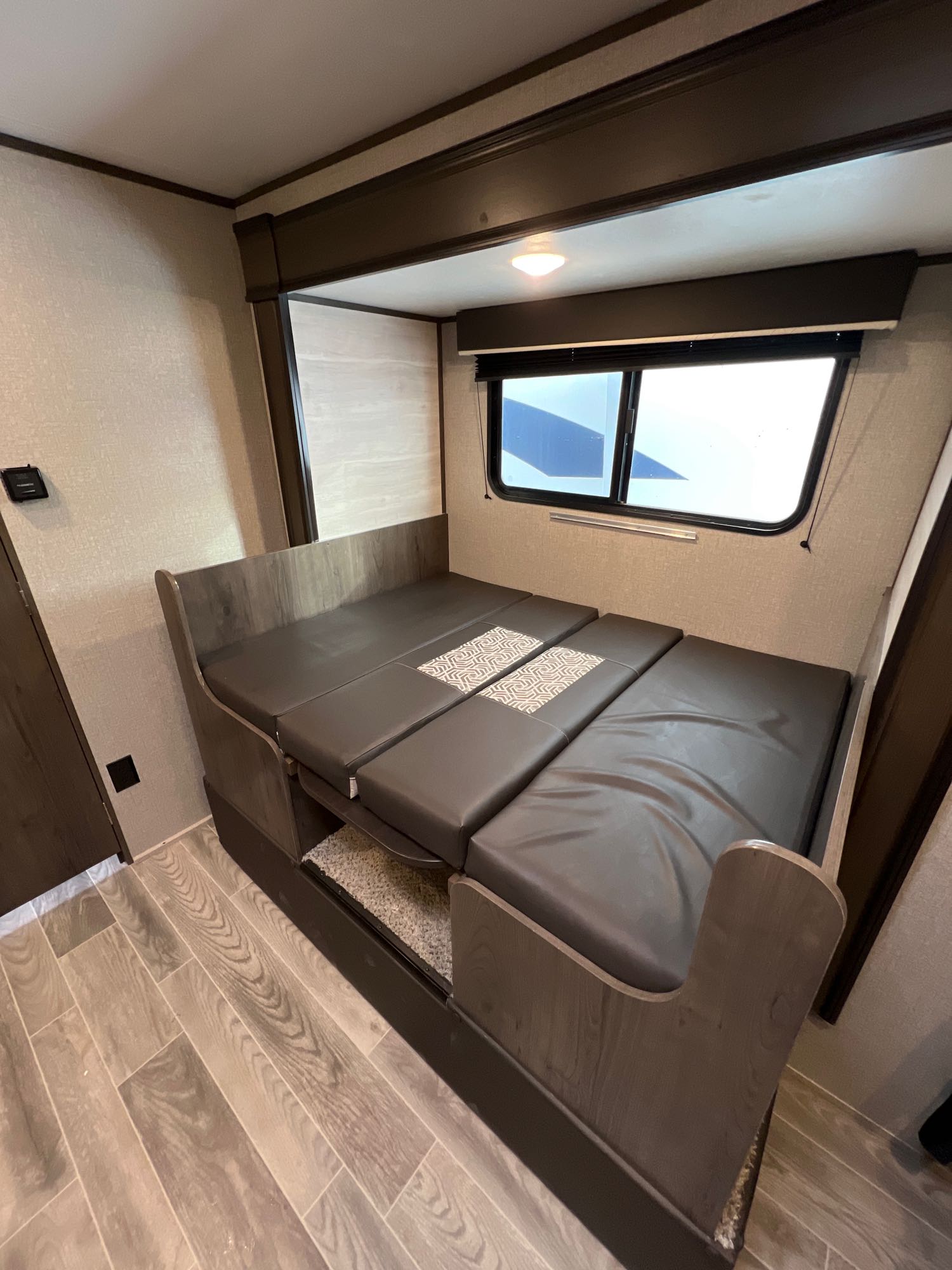 RV rental: Versatile dinette seating and convertible bed in a modern travel trailer interior, ideal for trips.. Jayco Jay Flight SLX Baja Edition 2021