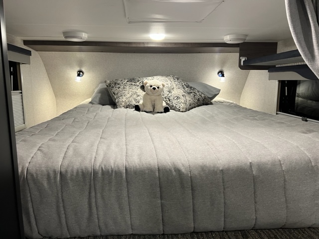 Queen size bed with comfortable bed topper. Well lighted with reading lights. . Lance 825 2022