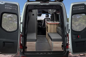 Sleeping area can be used with two twin beds or convert to a king size bed.  There is a full screen for the rear door area.. Airstream 24X 2022