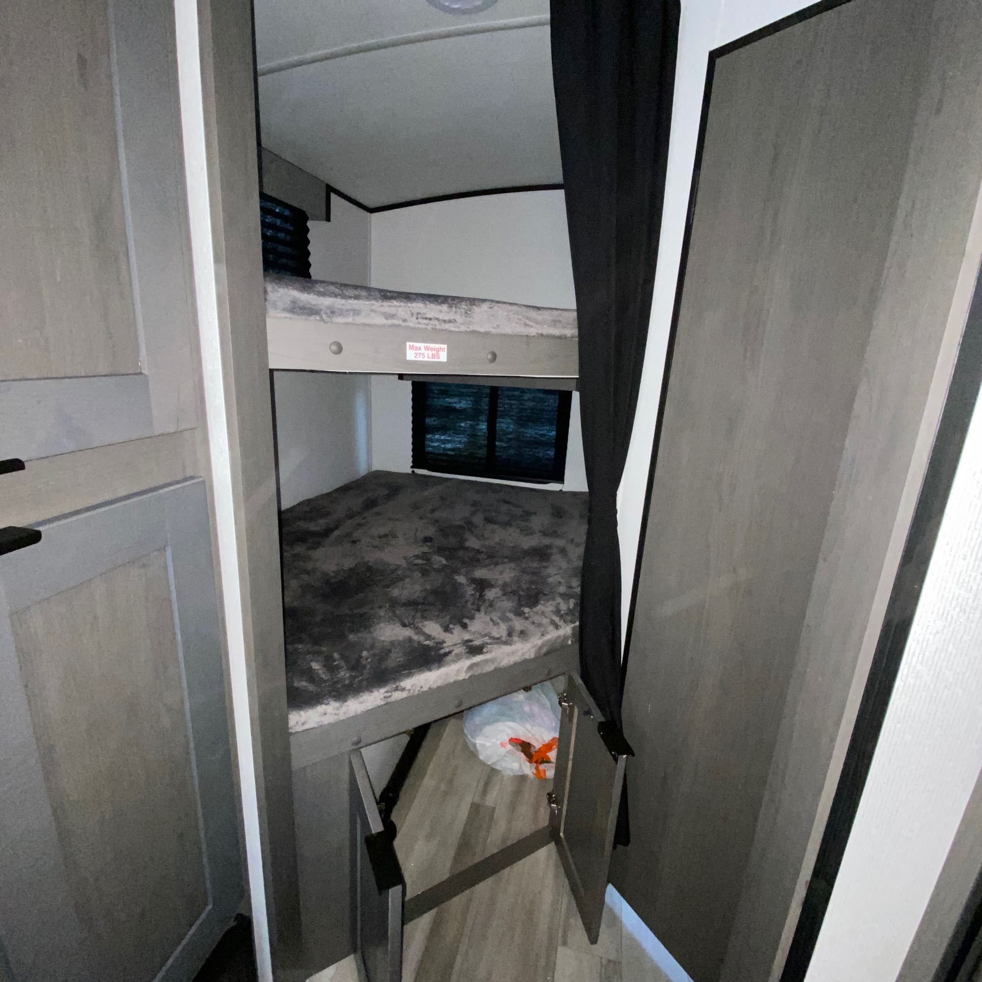 Compact bunk beds inside an RV rental. Ideal sleeping space for kids, with a 275lb weight limit on the top bunk.. Cruiser RV MPG Ultra Lite 2500BH 2021