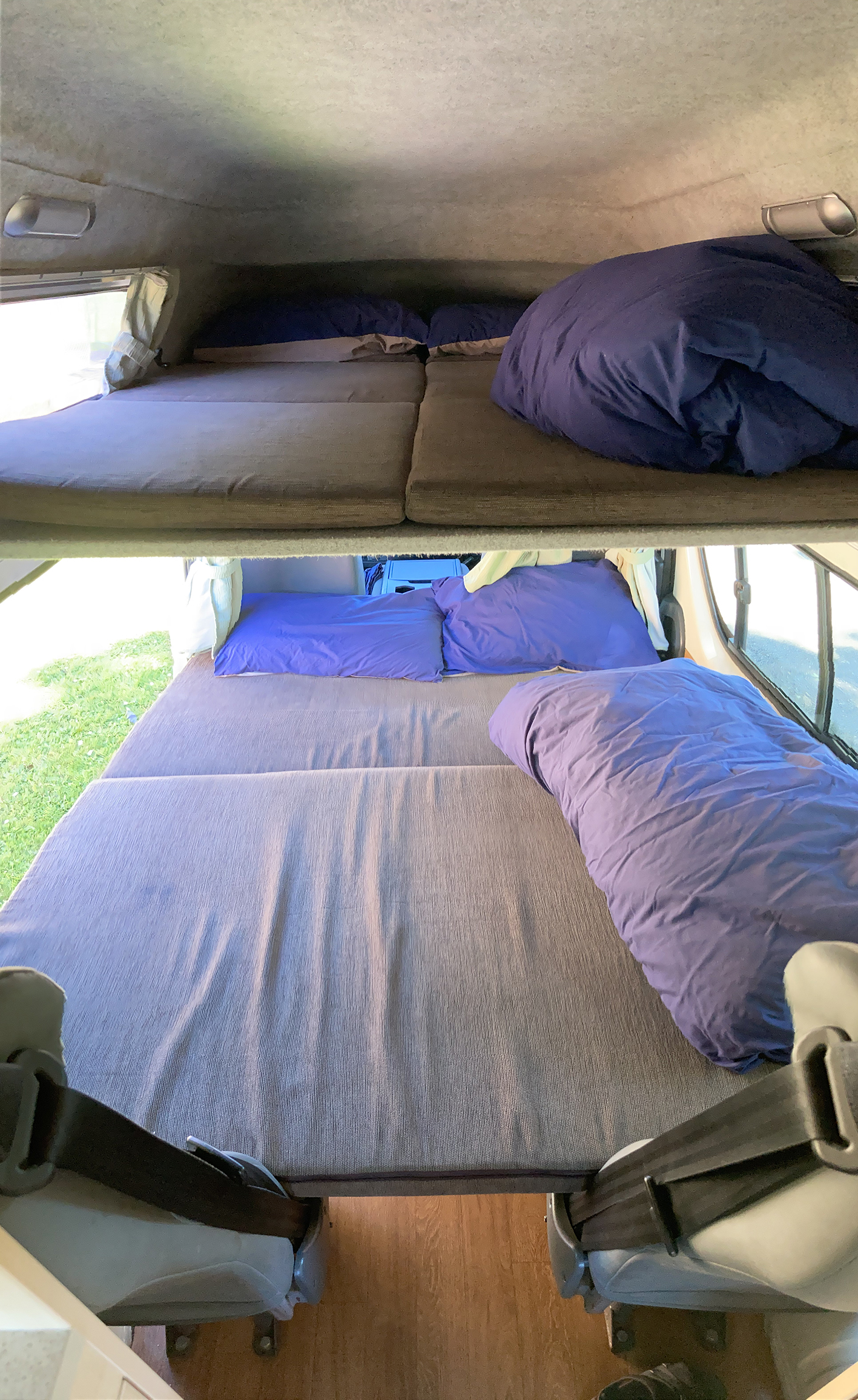 Inside this rv rental, find comfortable sleeping with an over-cab bunk and a lower convertible bed.. Toyota Hiace 2013