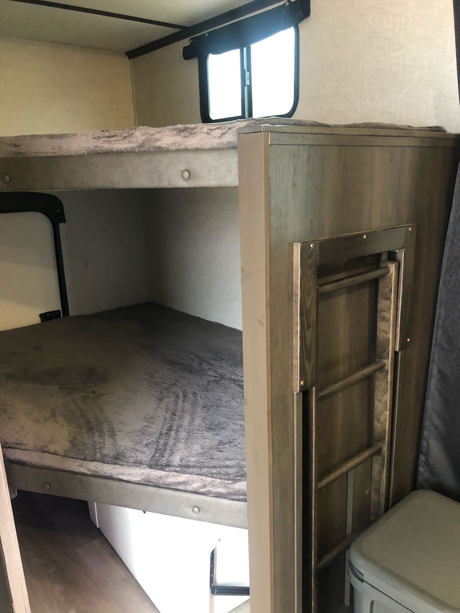 RV rental: Bunk beds with a mounted ladder on the right. Cozy sleeping ideal for family adventures in this camper.. Crossroads Cruiser Aire 2021