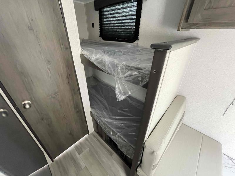 RV rental interior: new bunk beds with plastic wrap and a comfortable dinette seating area, ready for your next adventure.. Clipper Clipper Trailer 2021