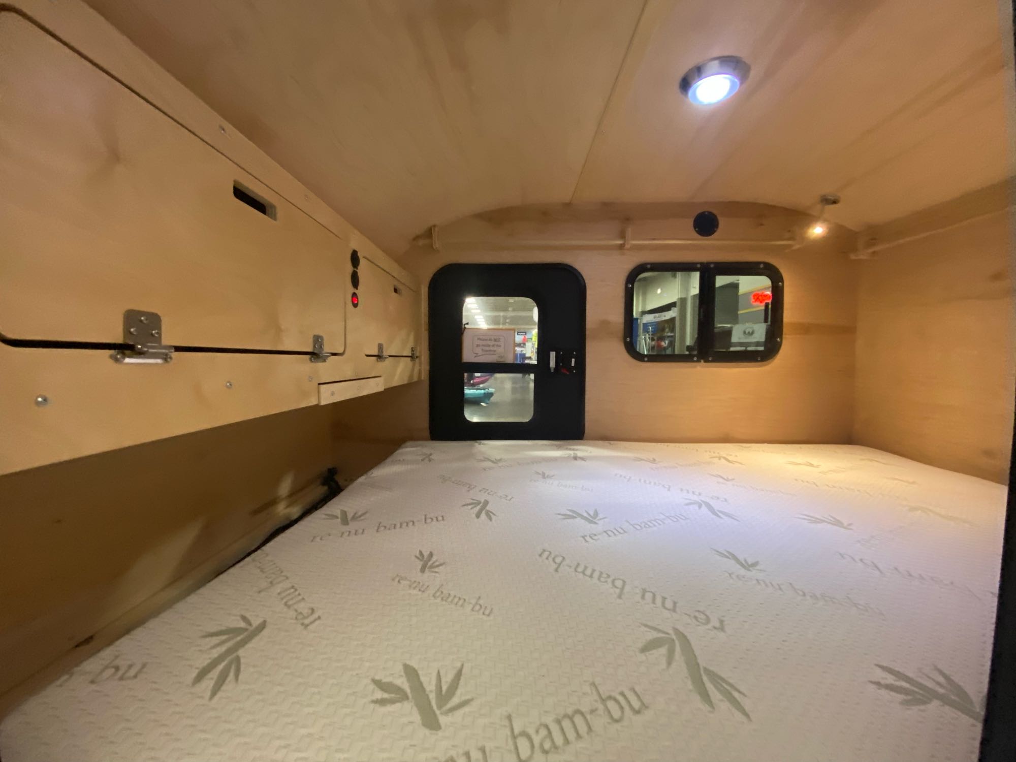 Step inside this compact RV rental. A wooden camper interior with a re-nu bamboo mattress and clever storage awaits your adventure.. TC Tear Drop TC Original 2022