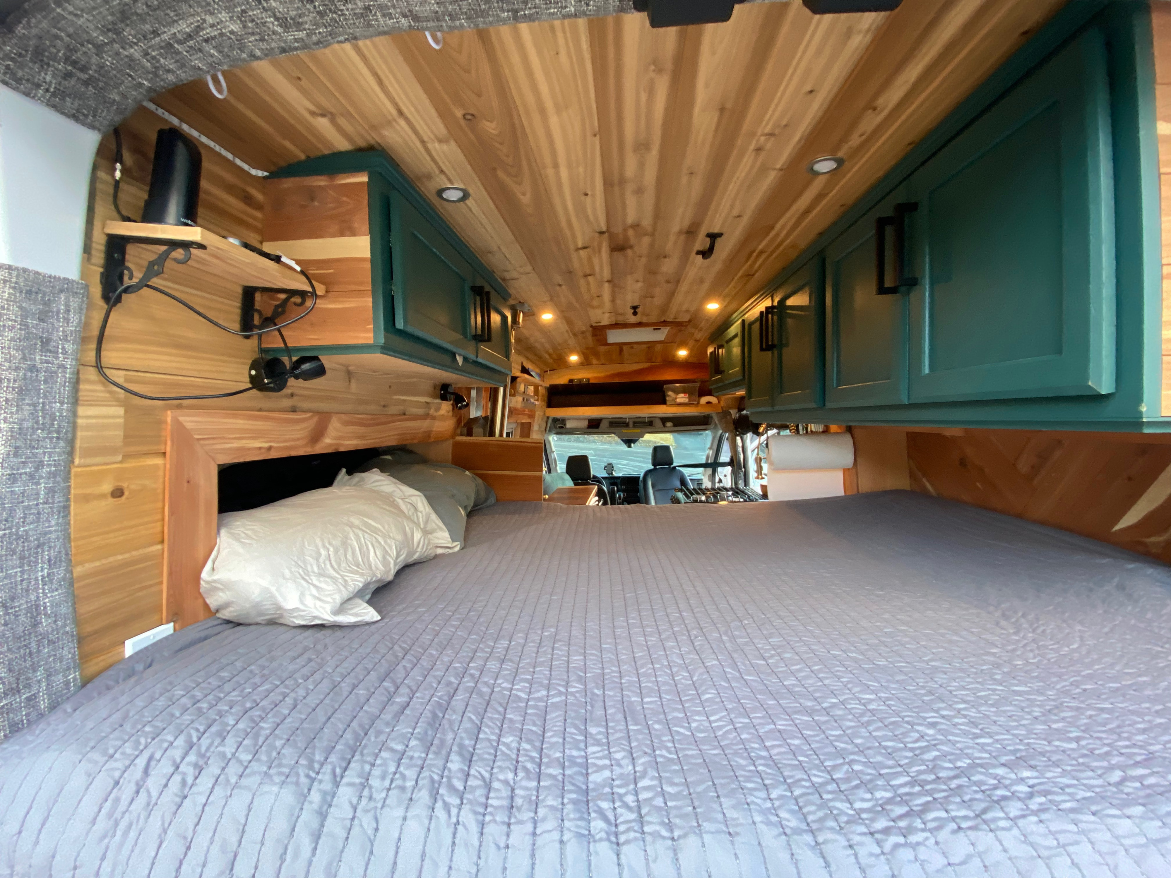 Cutouts for sleeping, sleep near the wood-stove and you have 6'3" of room to stretch out!. Ford Transit 2020