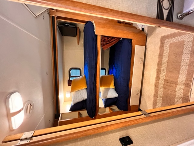 Twin bunks outfitted with Beddy's mink linens with storage drawer below. Both beds equipped with TVs for entertainment and slider windows . Winnebago Minnie Winnie 2015