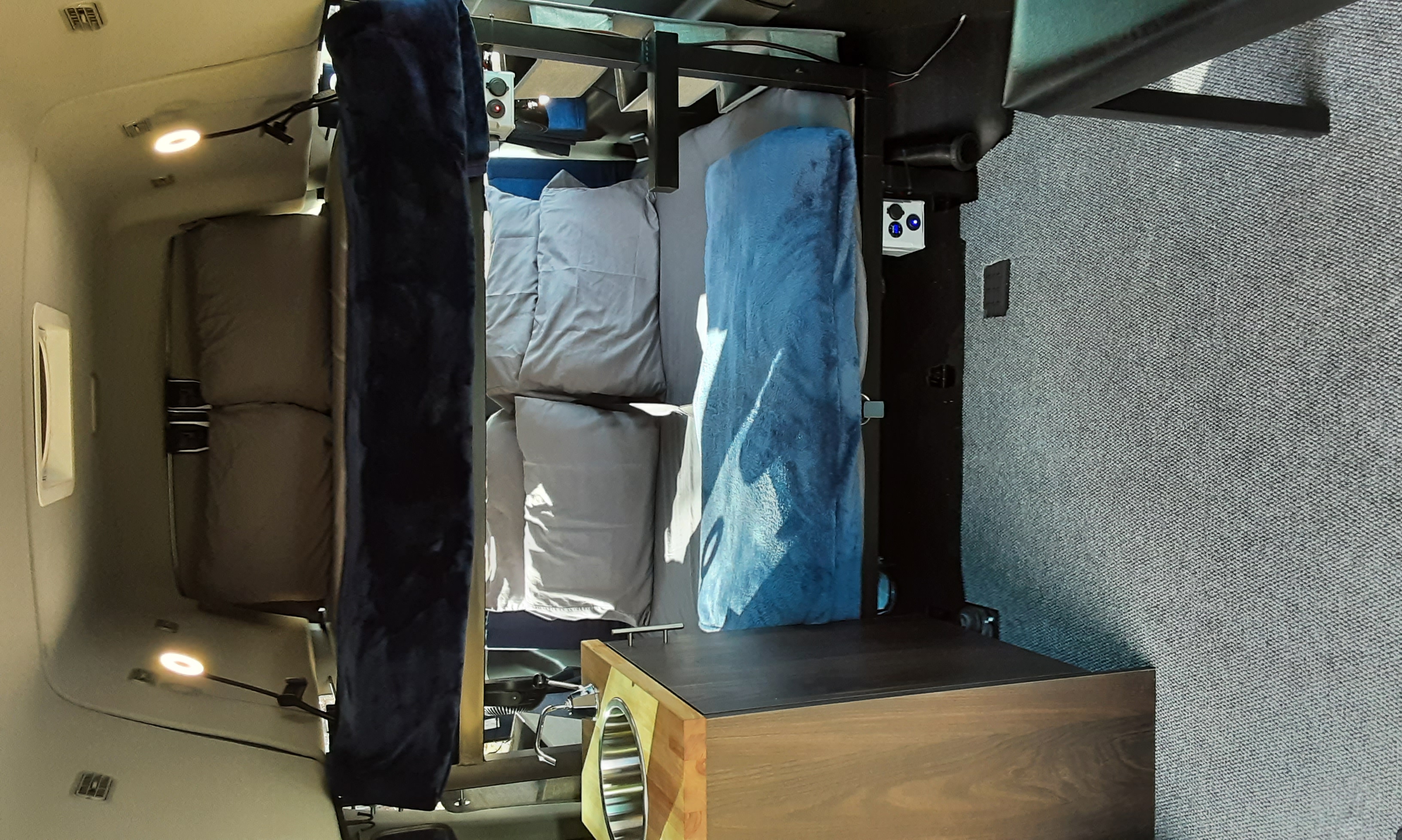 This RV rental features comfortable bunk beds and a compact kitchenette with a sink, perfect for camper travel.. Ford transit 2017