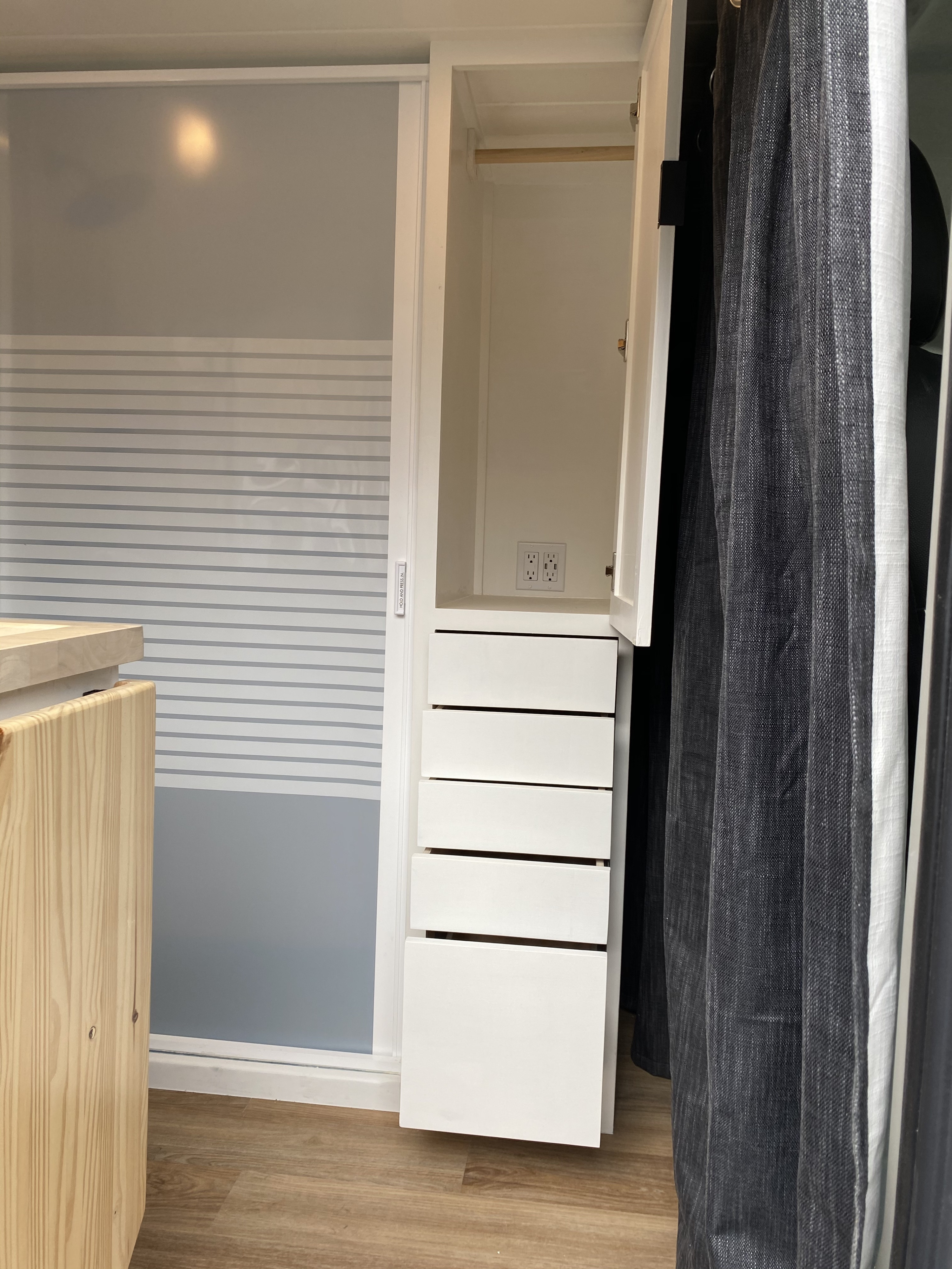 RV rental: Bright interior with a white wardrobe, five drawers, power outlets, and a frosted sliding door.. Dodge Ram Promaster 2500 Long 2019