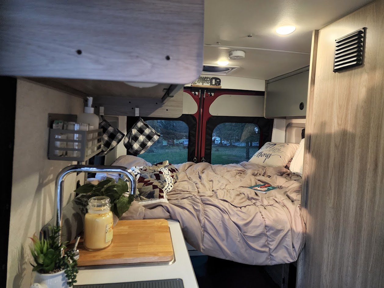 Experience van life! This rv rental offers a comfortable bed, compact kitchen, and storage for your road trip.. Winnebago Solis 2022