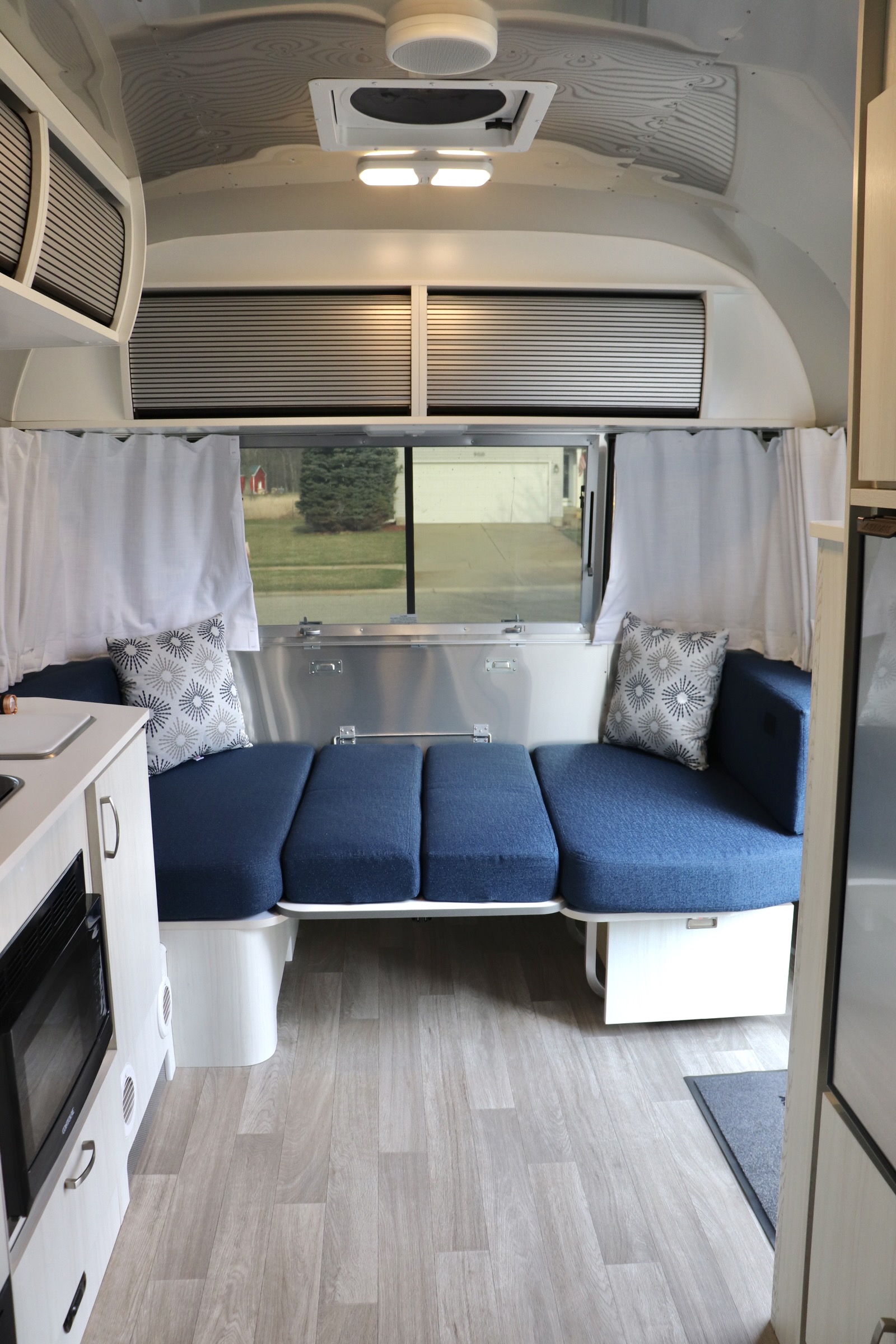 The dining table folds down to become a guest bed.. Airstream Bambi 2022