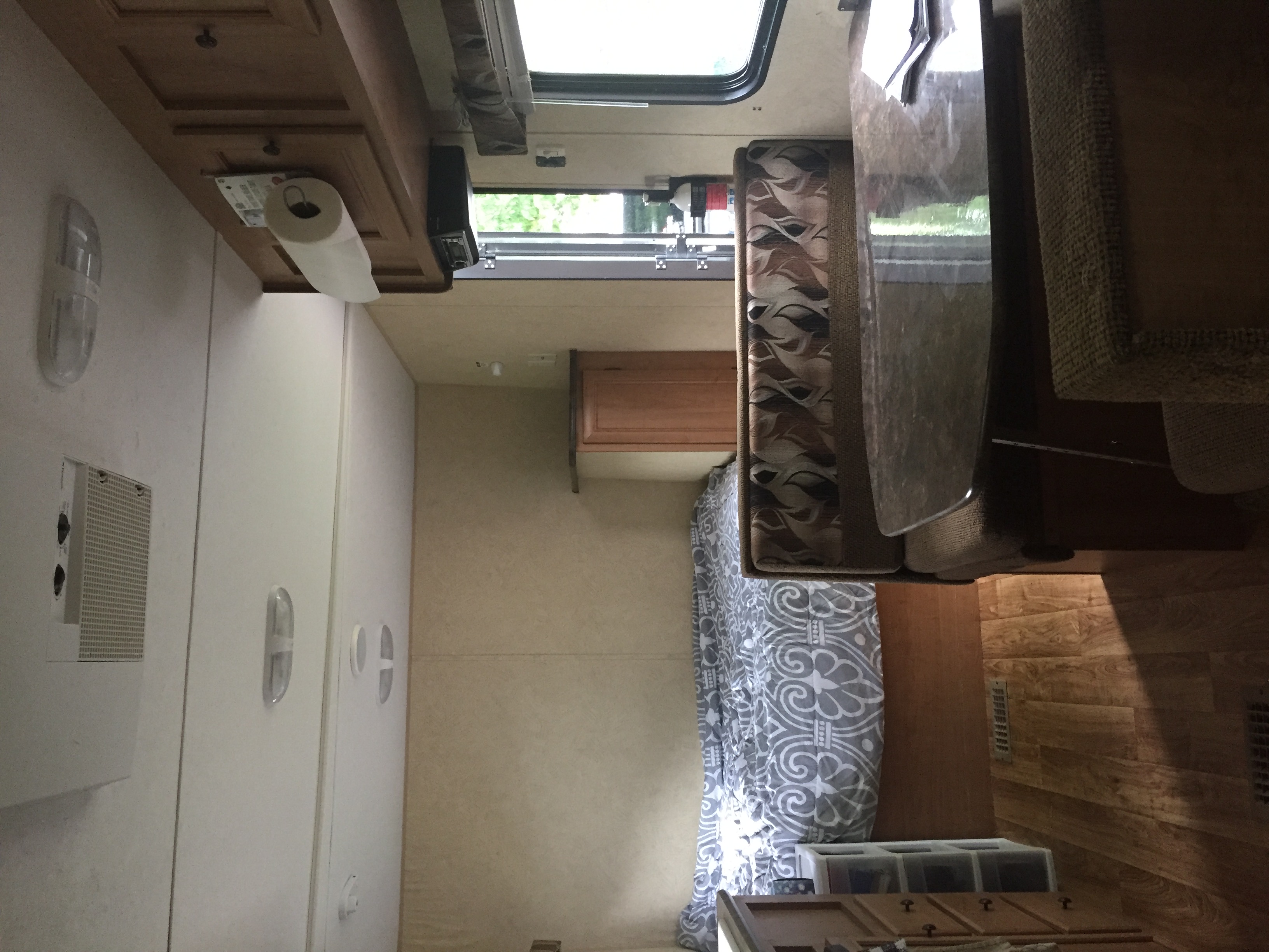 RV rental interior: A compact kitchen, dining booth, and cozy bed area offer convenience for your next travel adventure.. Bobcat Bobcat Trailer 2013