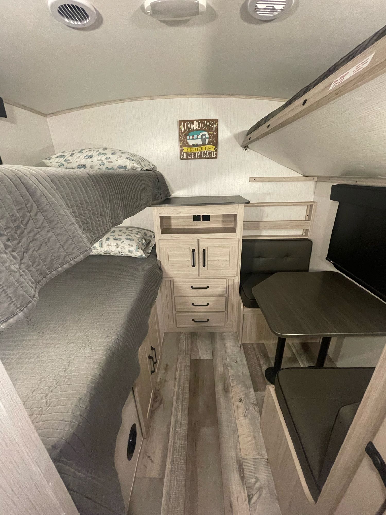 RV rental: Cozy bunk beds & dinette area, perfect for travel trailer adventures.. Heartland Sundance 294BH 2022