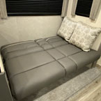 Unfold comfort! This gray sofa bed in an RV rental provides extra sleeping space, ideal for your RV adventure.. Coachmen Catalina 2022